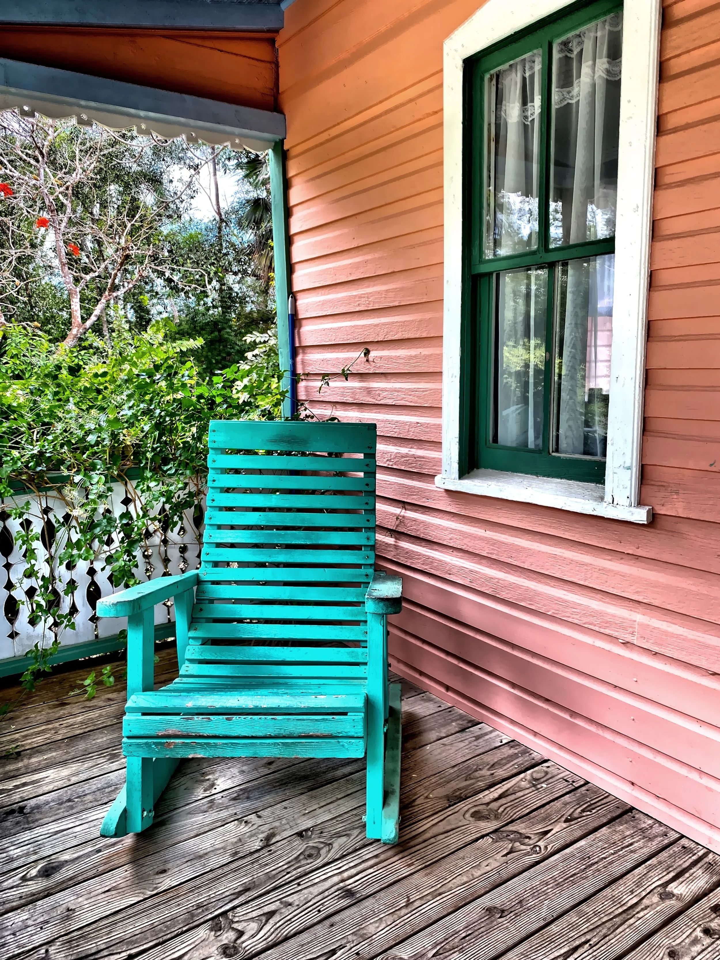 The colorful cottage front porch of Rankine House in the Heritage Garden, Queen Elizabeth II Botanic Park 