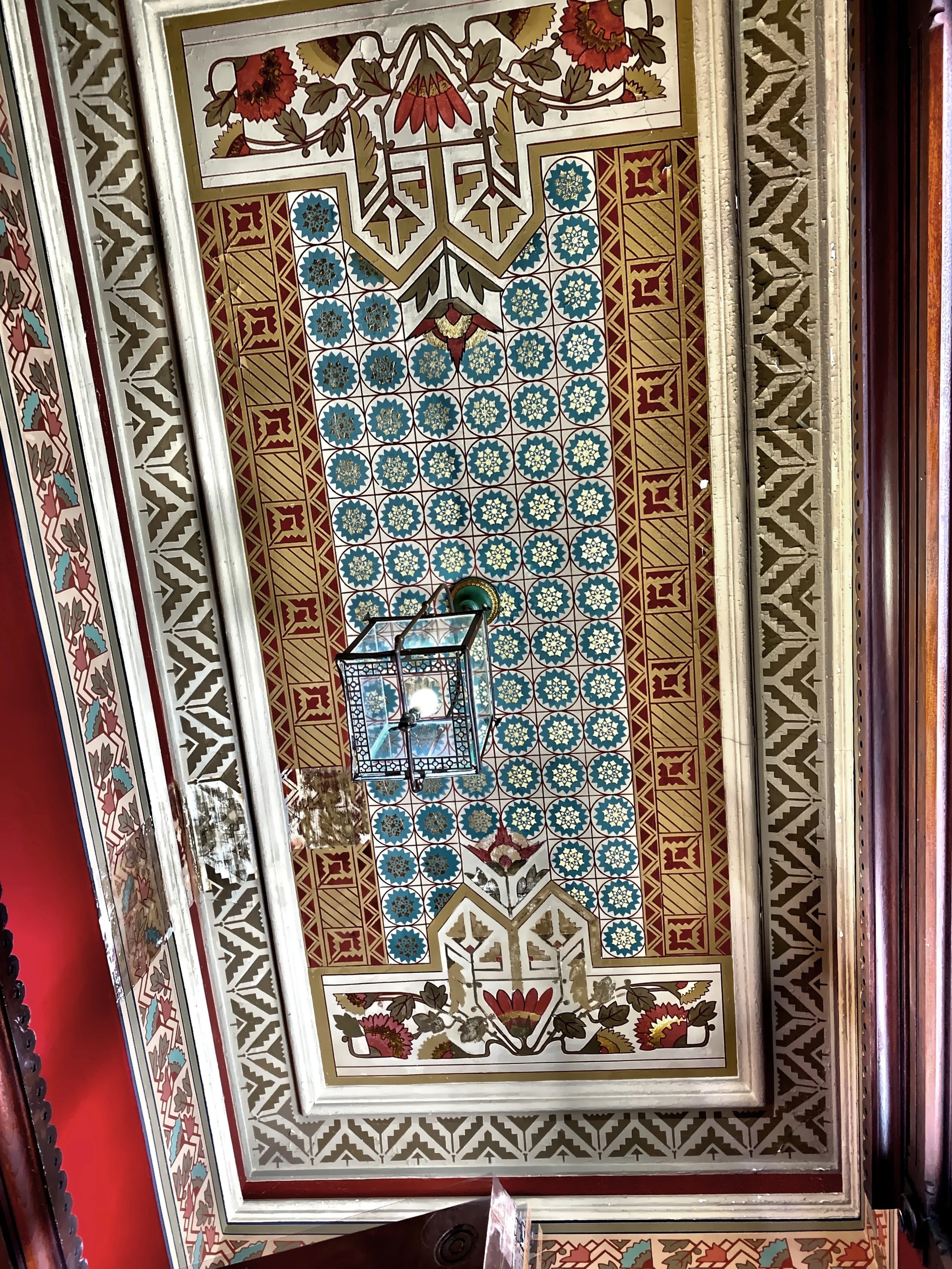  The bright and cheery intricate stencil work on the ceiling in the vestibule 