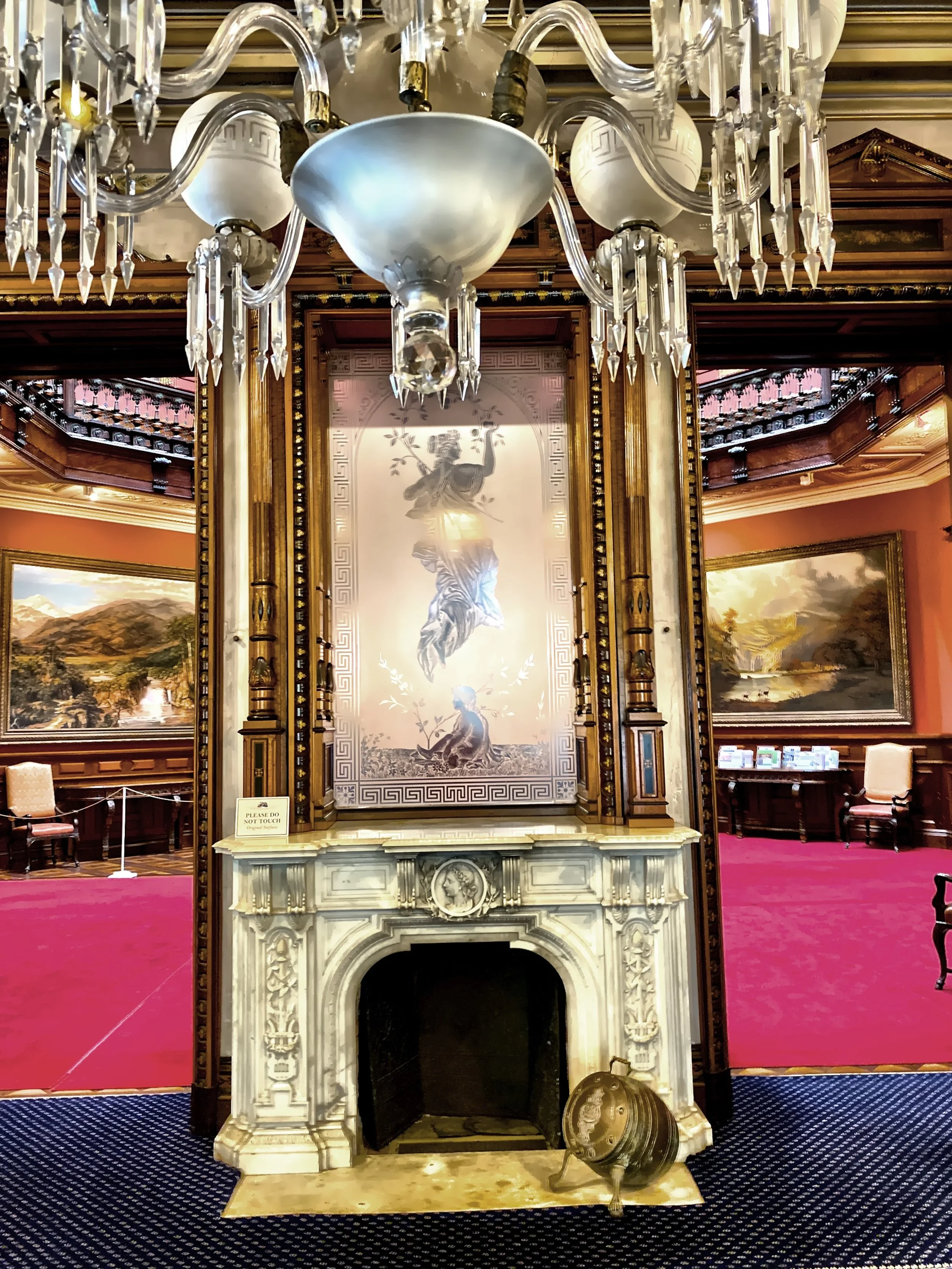  The Italian marble fireplace, in the Music Room,  with etched glass panel above it, depicting Pomona, the Roman goddess..  