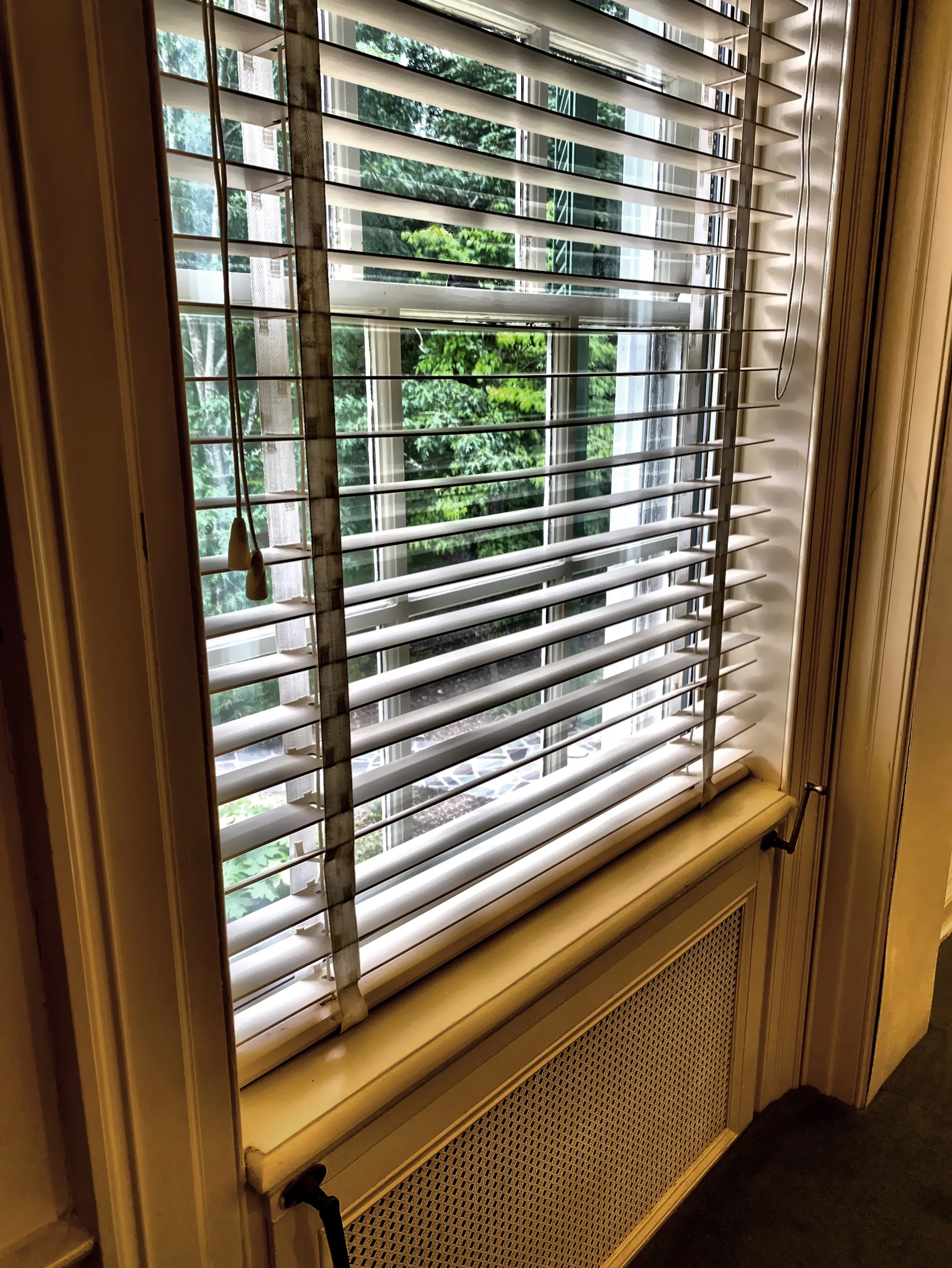  The cranks at the bottom of the windows made it easier to open and close the exterior house window shutters. 