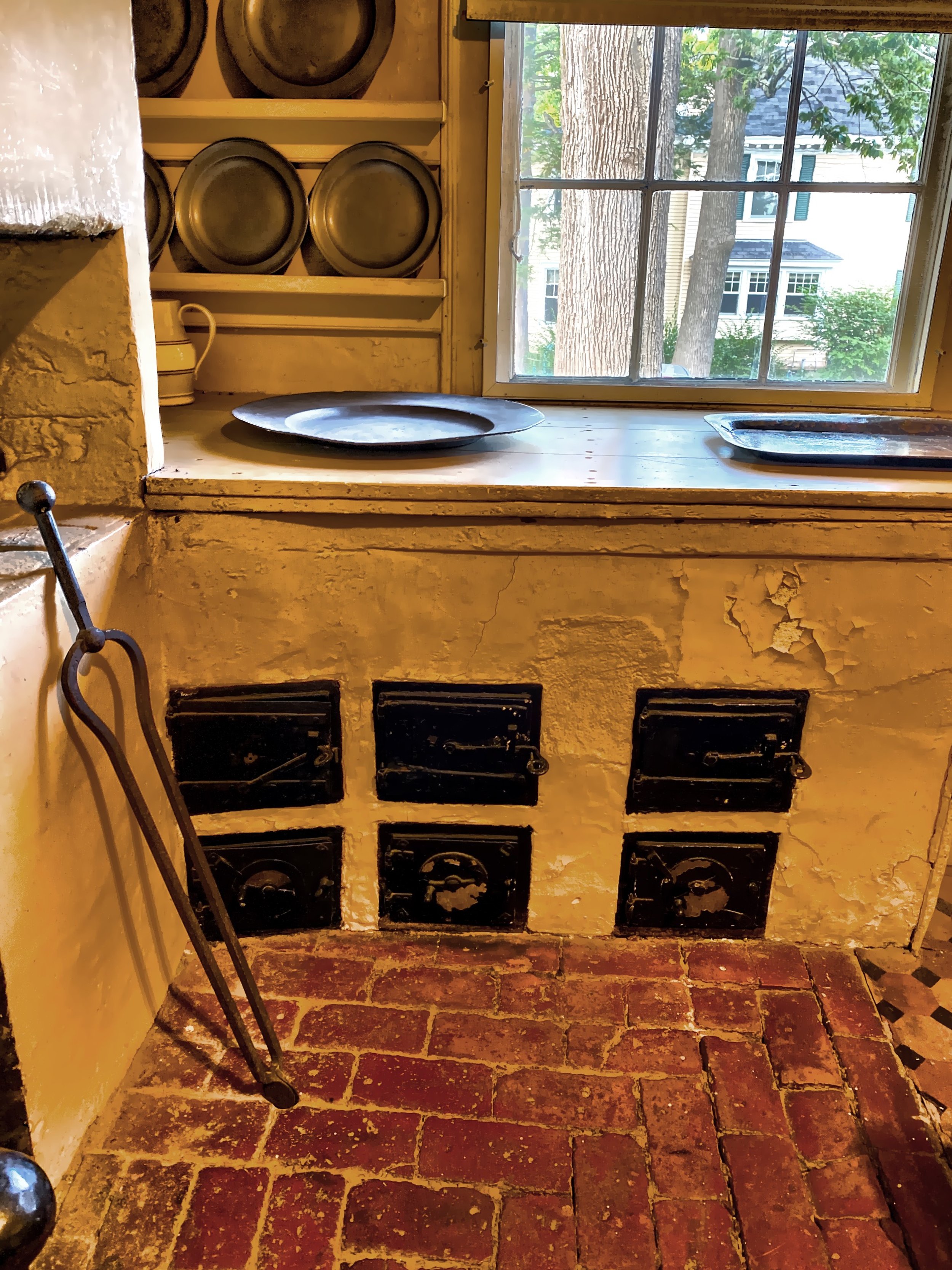  The six small doors below the counterserve the Rumford range which is covered by the updated countertop. 