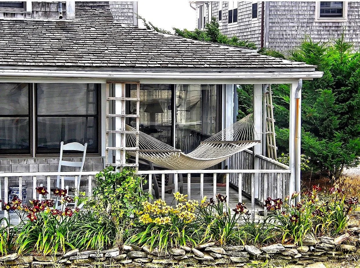  Who wouldn’t want to catch a nap on this porch hammock? 