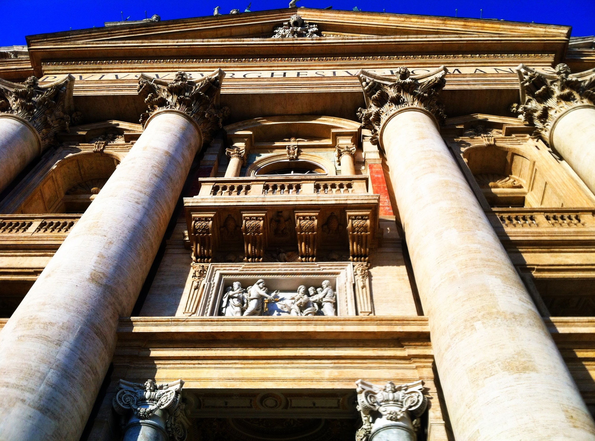  Looking up at the main facade of St. Peters Basilica 