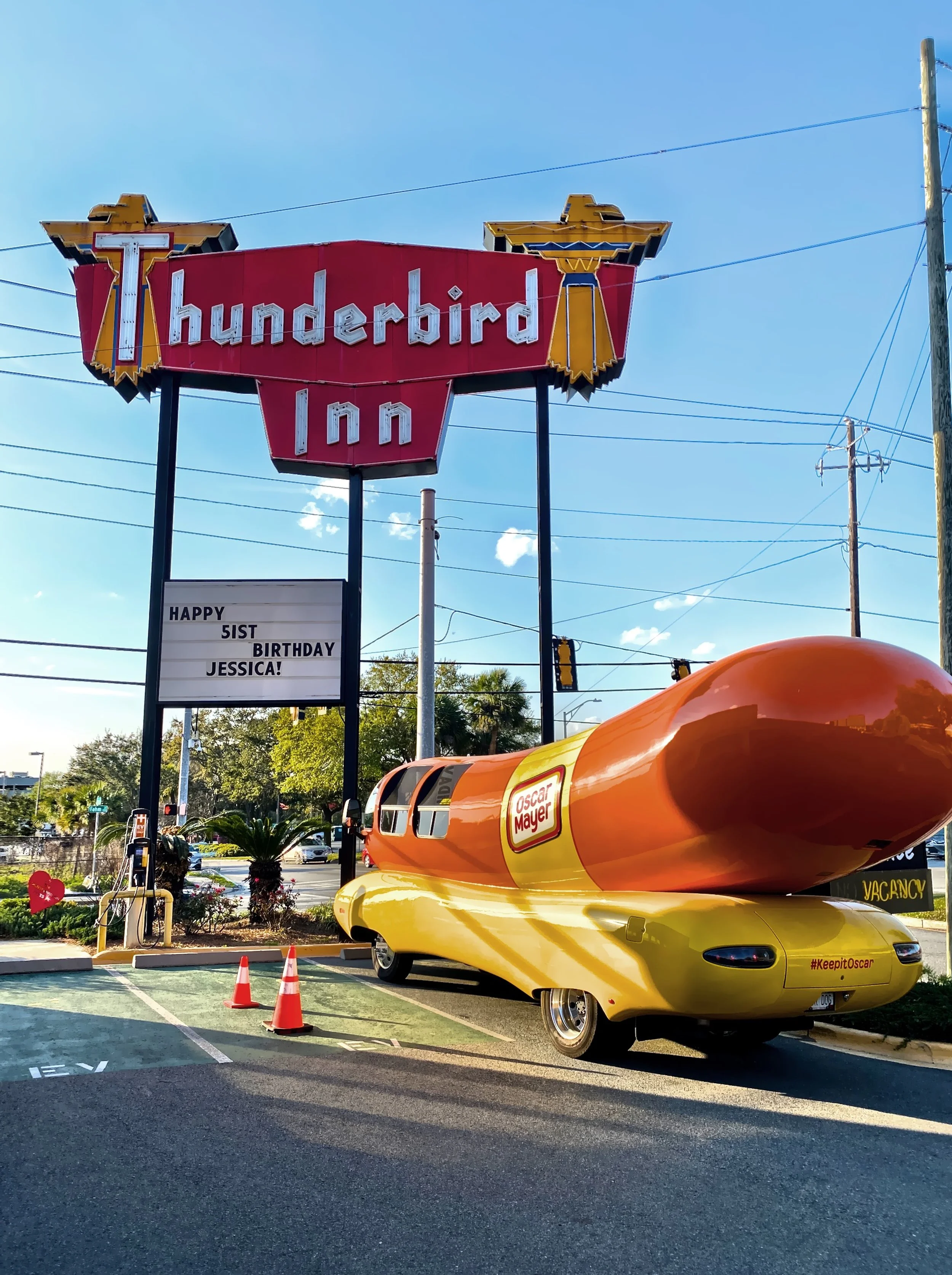  The Oscar Meyer Weiner Mobile in the parking lot of the vintage Thunderbird Inn. 