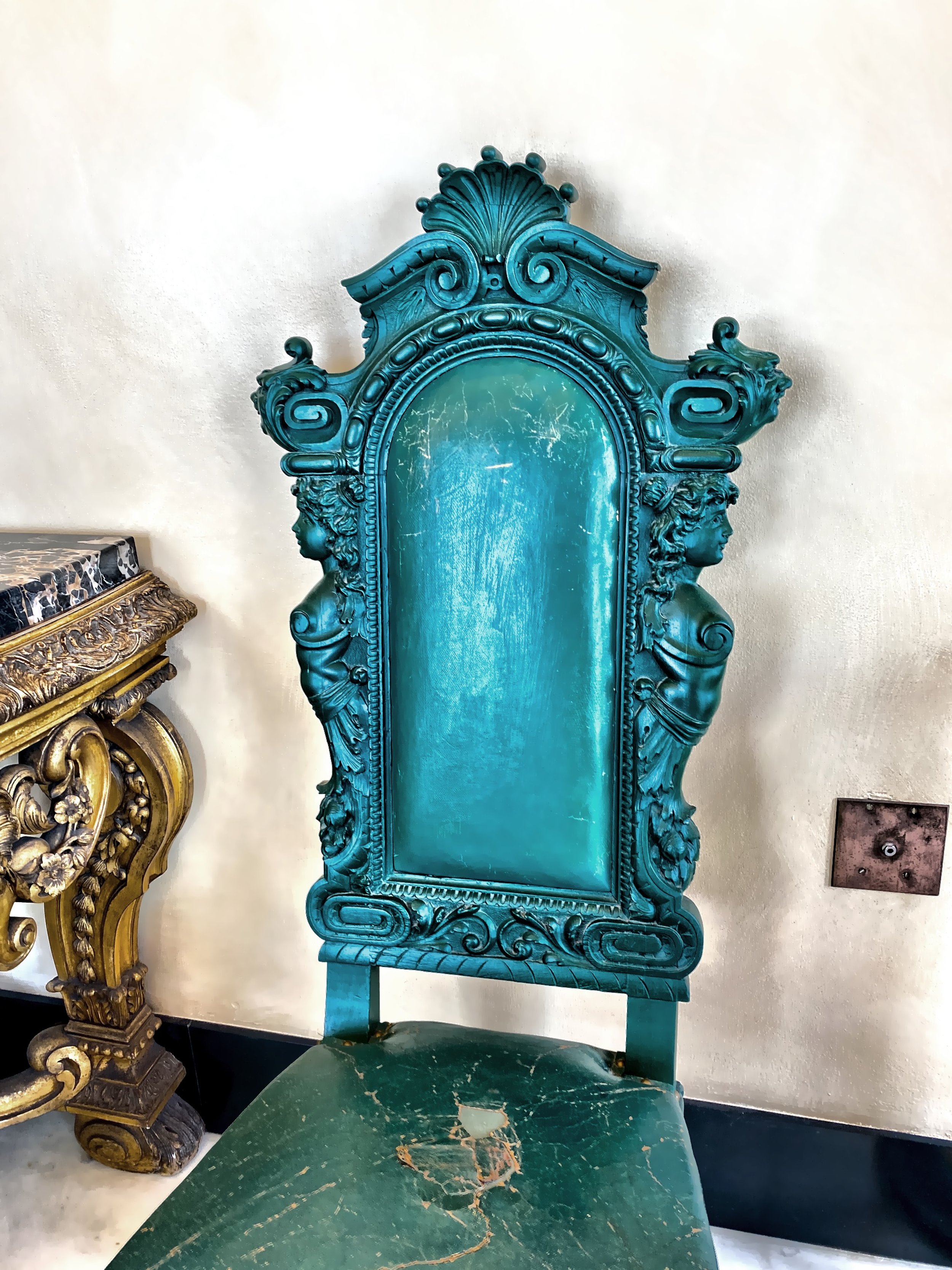  One of the beautifully carved chairs in the Breakfast Room. 