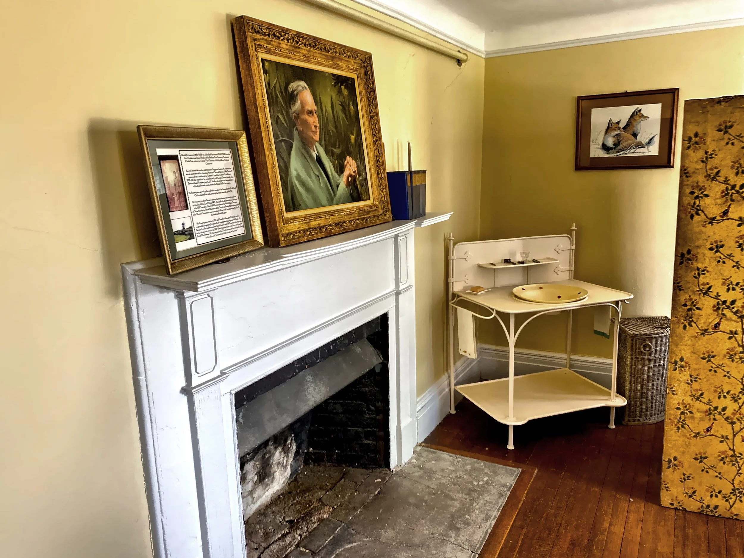  The wash basin here in Mr. Pomeroy’s room is original.   A family member donated the portrait of Mr. Pomeroy, resting on the fireplace mantle. 