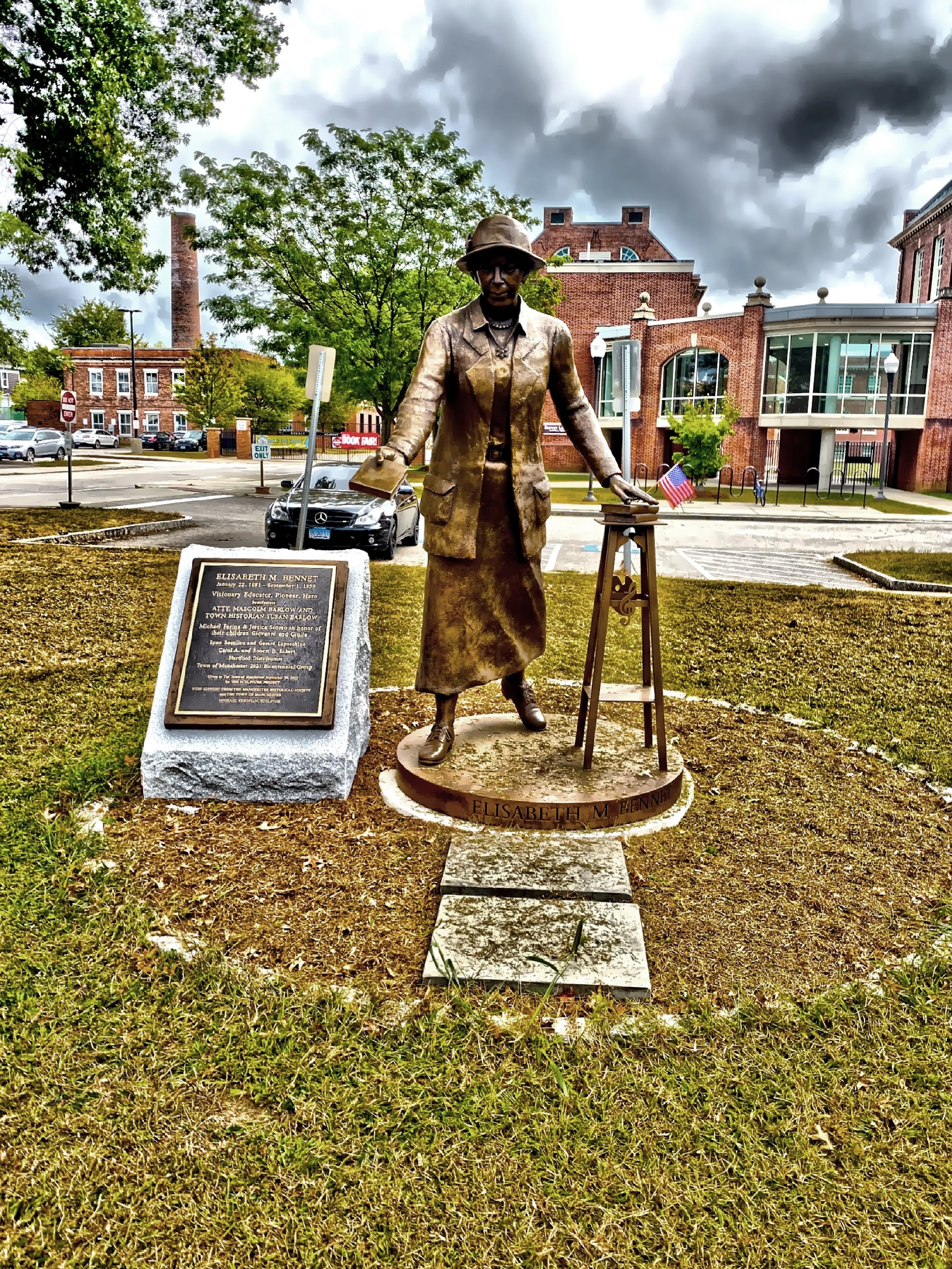  A statue honoring Elizabeth Bennett on Main Street. Miss Bennett came to Manchester in 1909 to train other teachers and she was credited with many "firsts" in the Manchester public school system. 