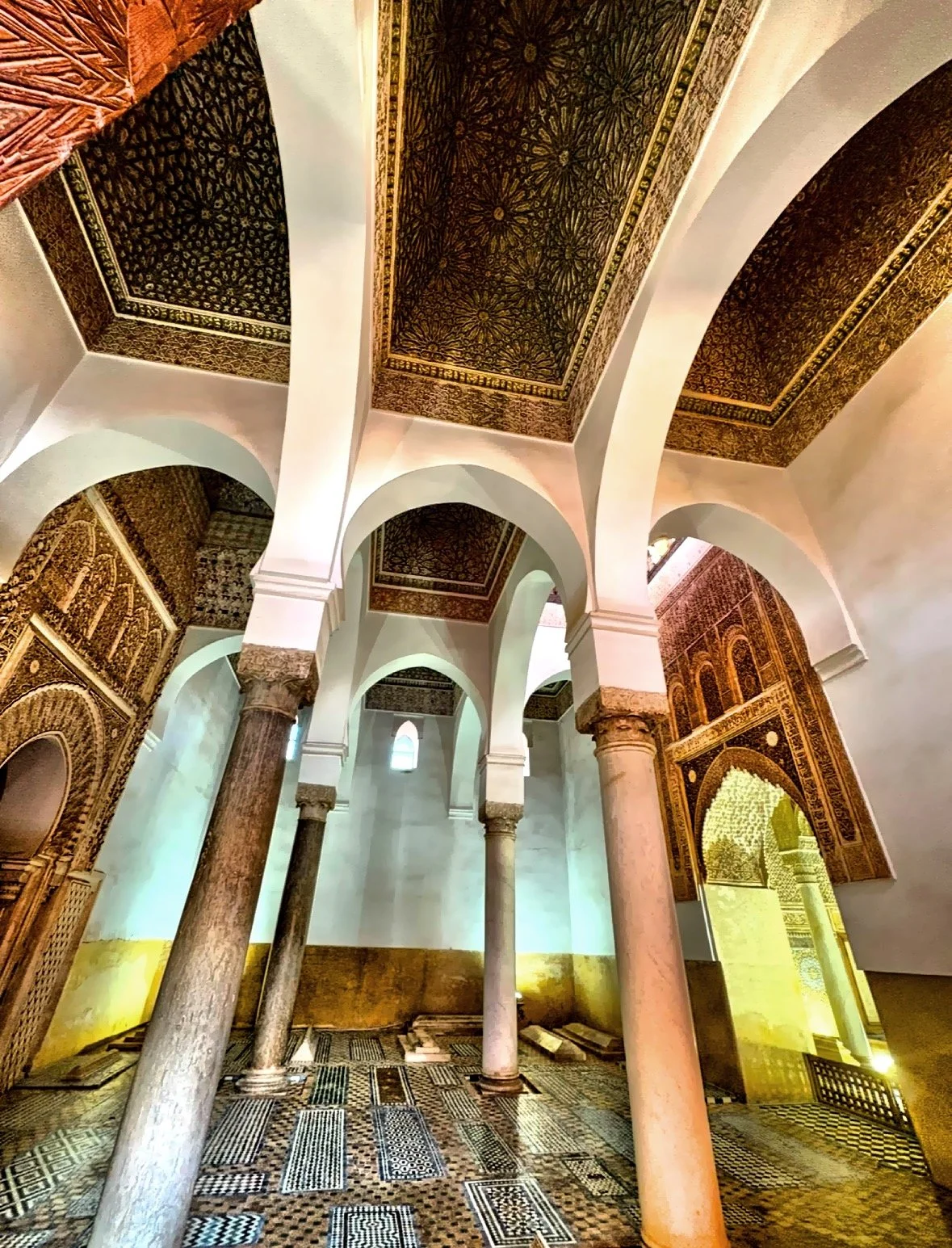  The tombs are composed of two main sections, each containing several chambers and decorated with intricate stucco carvings and colorful tiles. 