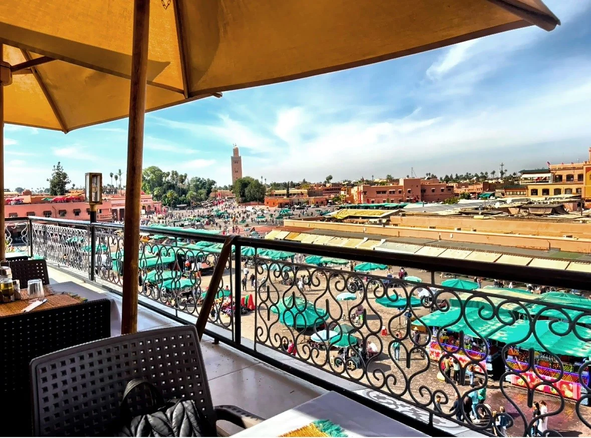  A view from one of the second-floor restaurants overlooking Jemaa el-Fnaa Square in the Medina, packed with local shoppers, visitors and vendors and stalls. 