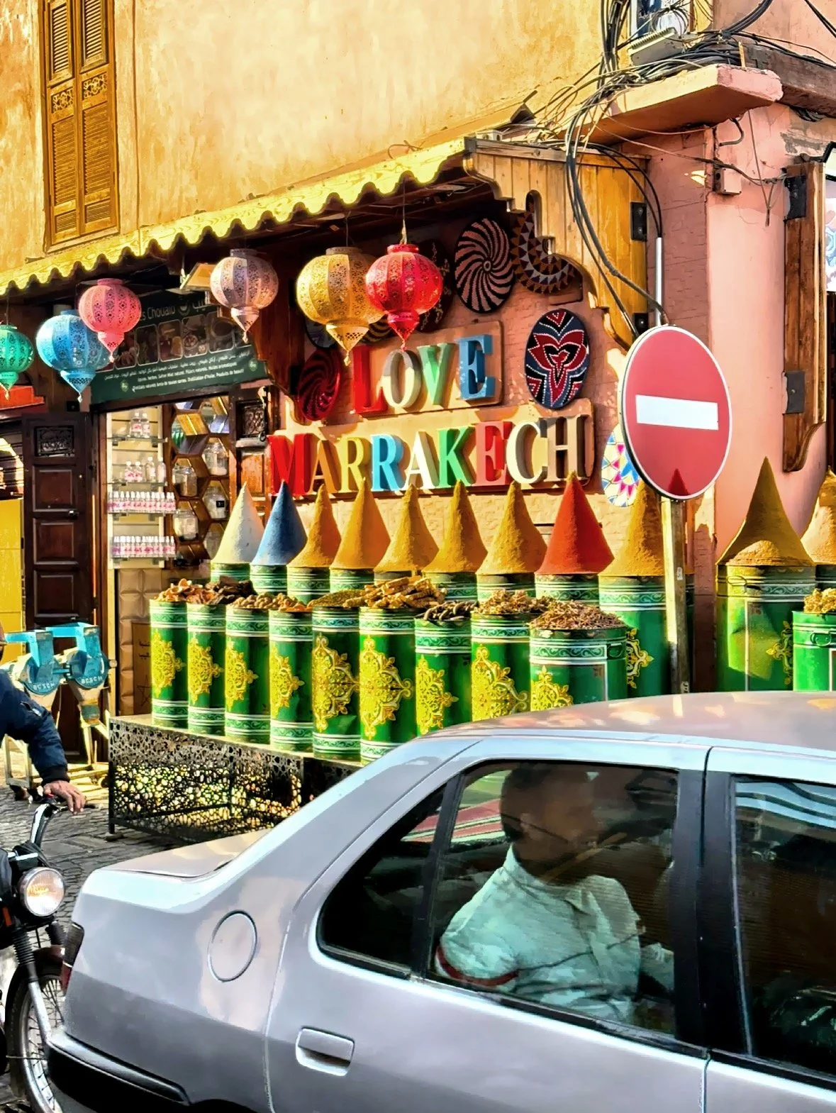 A spice shop with displays of colorful spices in cone-shaped piles. 