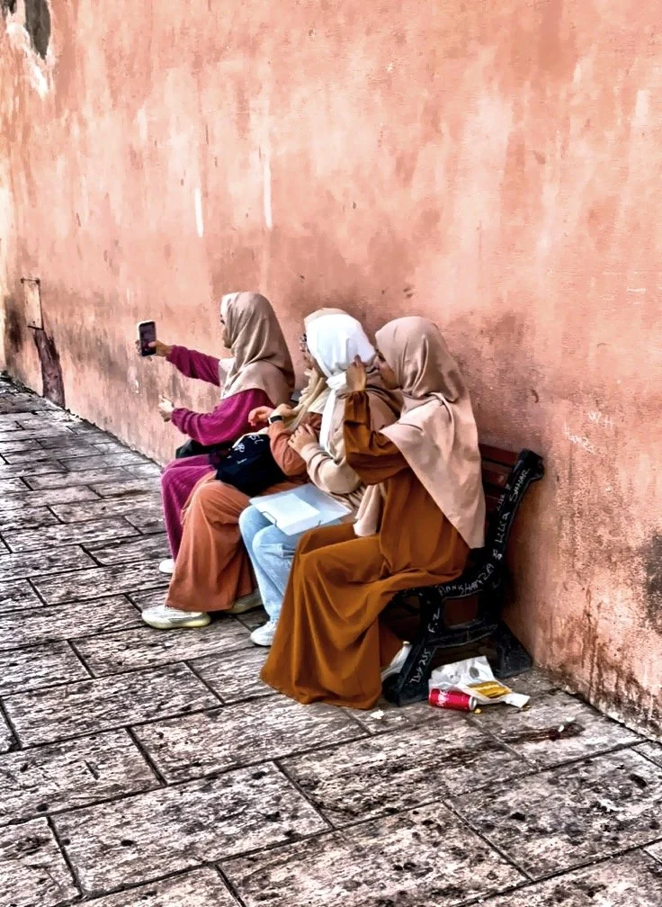  Local woman capturing a selfie moment. 