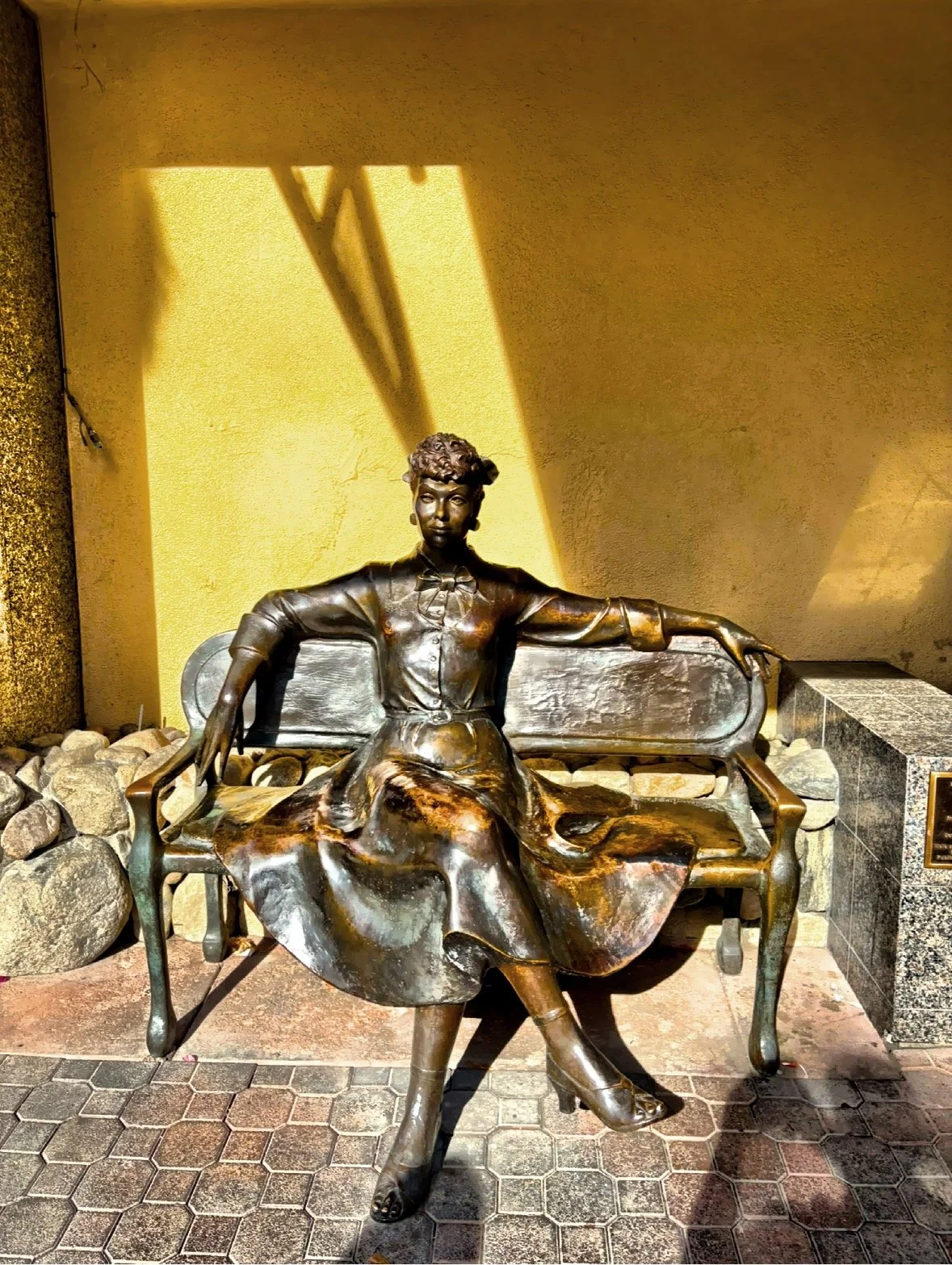  The life-size bronze sculpture of Lucille Ball on a bench was sculpted in 1995 by Emmanuil and Janet Snitcovsky. 