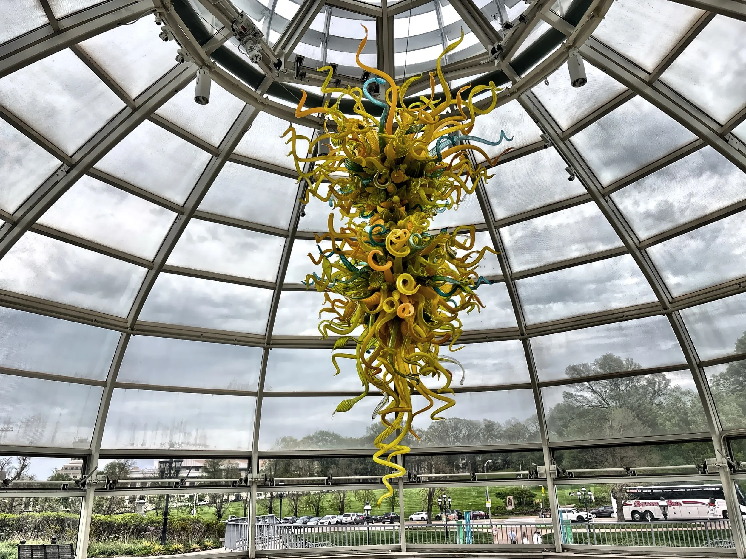  This is Goldenrod, Teal and Citron Chandelier created by Dale Chihuly hanging in the glass-domed entrance of the Welcome Center. 