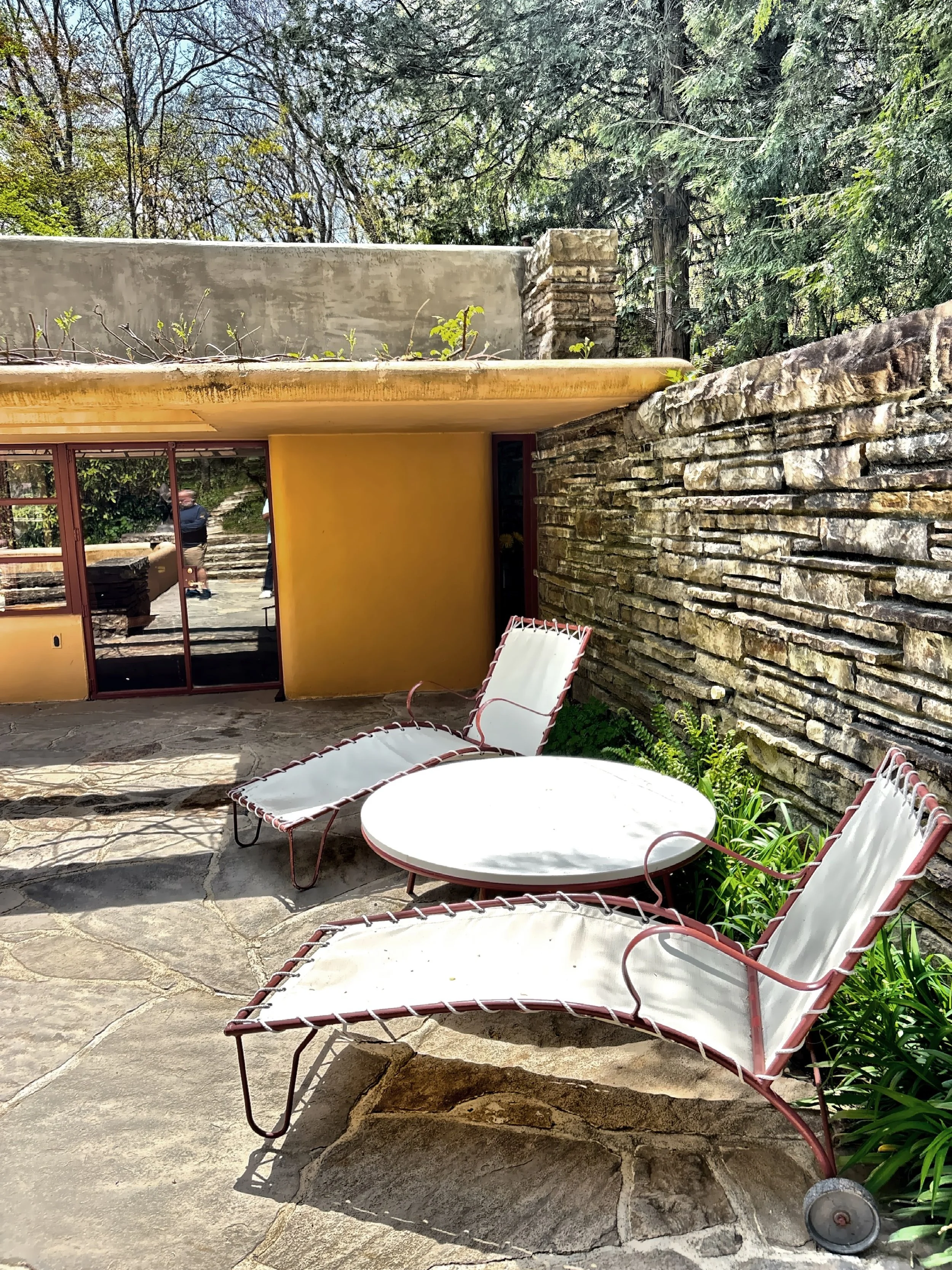  Wright designed additional guest quarters set into the hillside directly above the main house and linked by a covered walkway.  This is the terrace and pool area. 