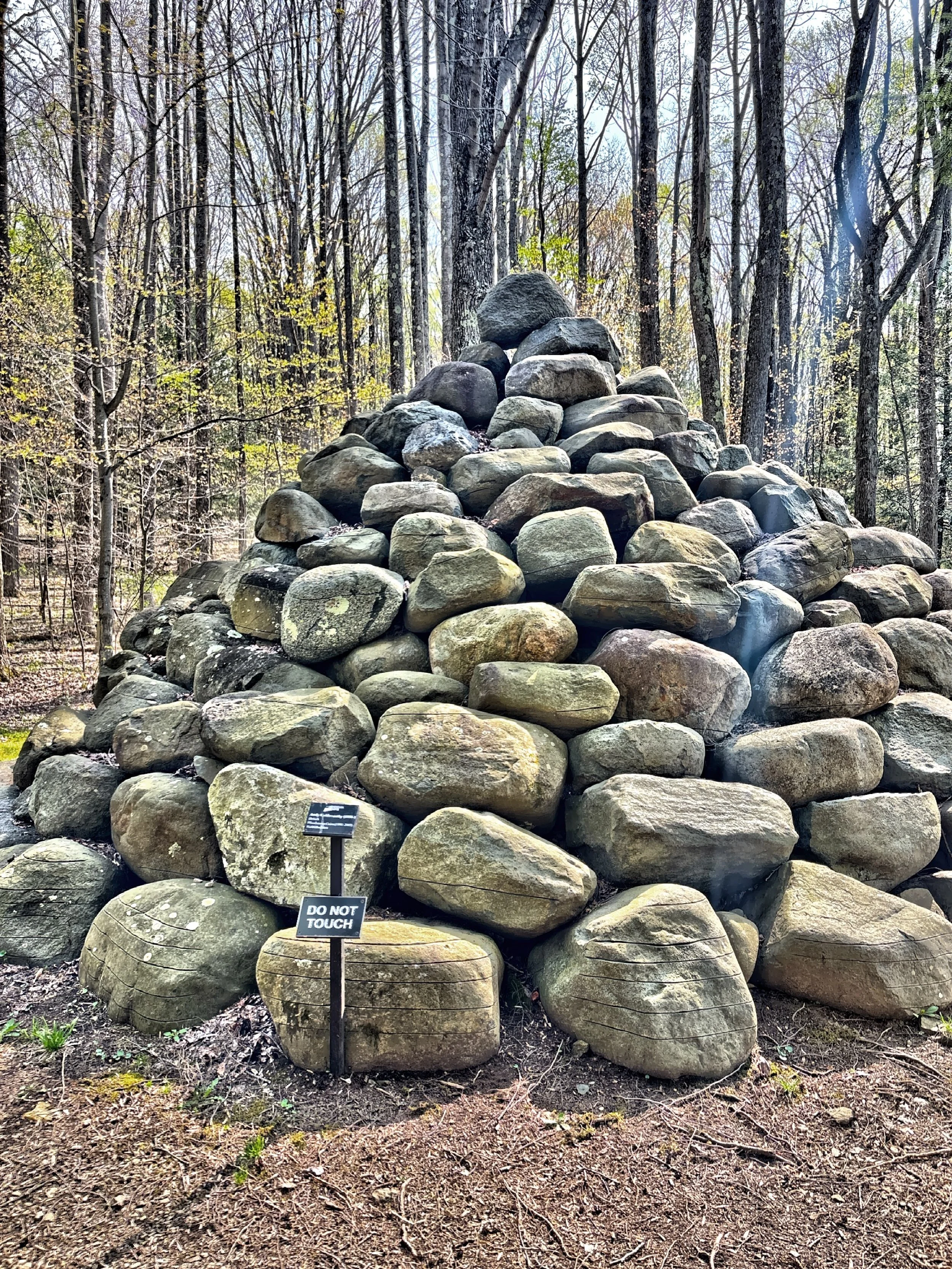  A boulder cairn art installation along the Woodland Walking Trail. 