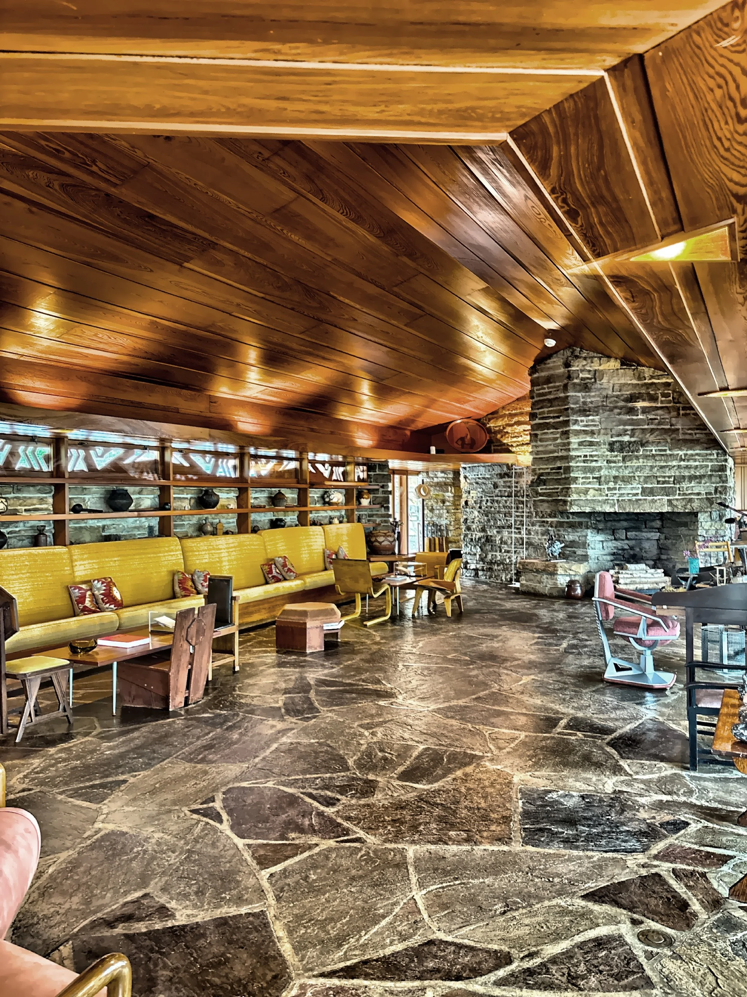  The main living area with built-ins, stone floor and wood ceiling. 