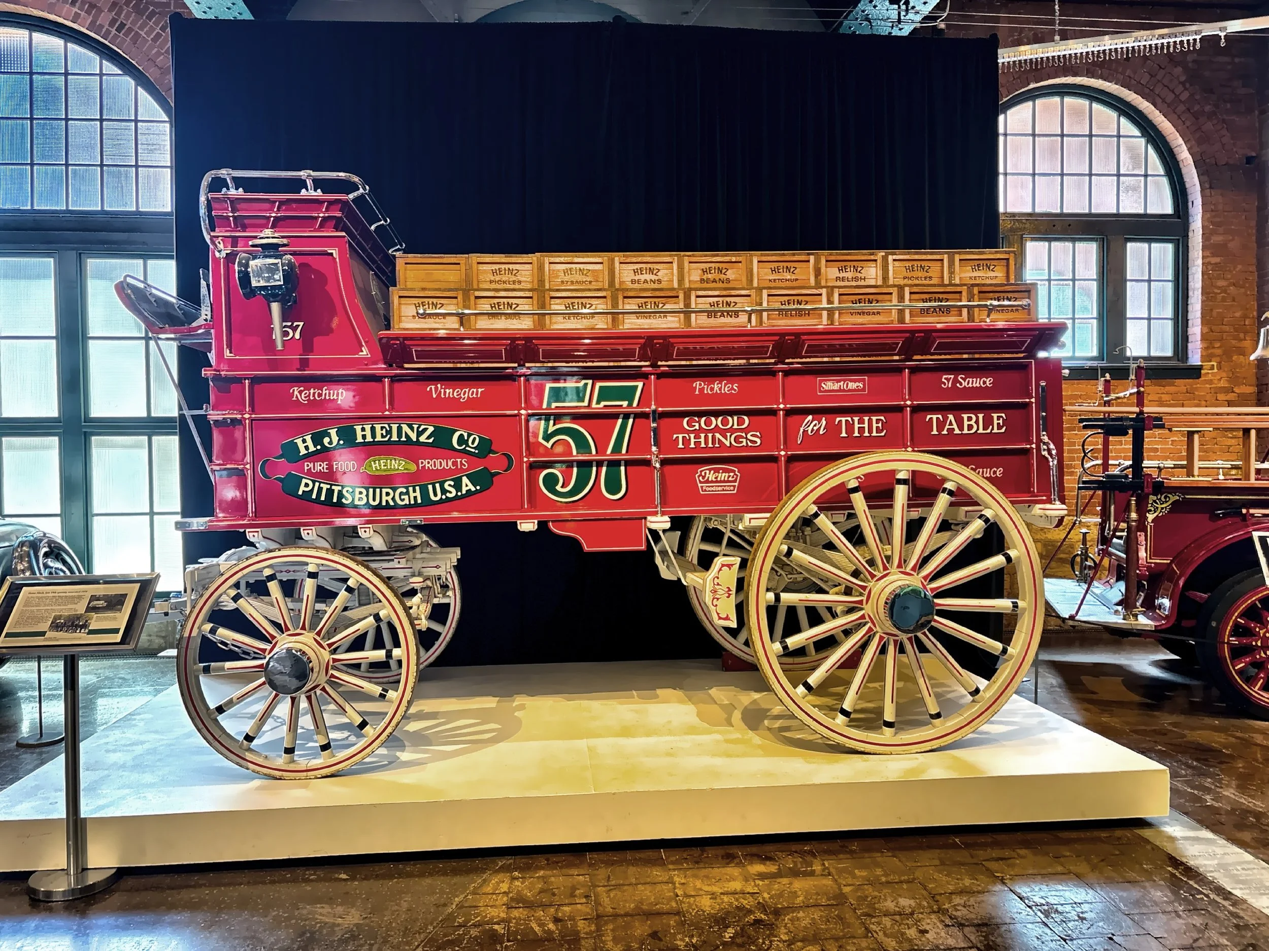 Vintage red Heinz Company delivery wagon features the Heinz logo and slogans like “57 Varieties” and :Good things for the table”.  