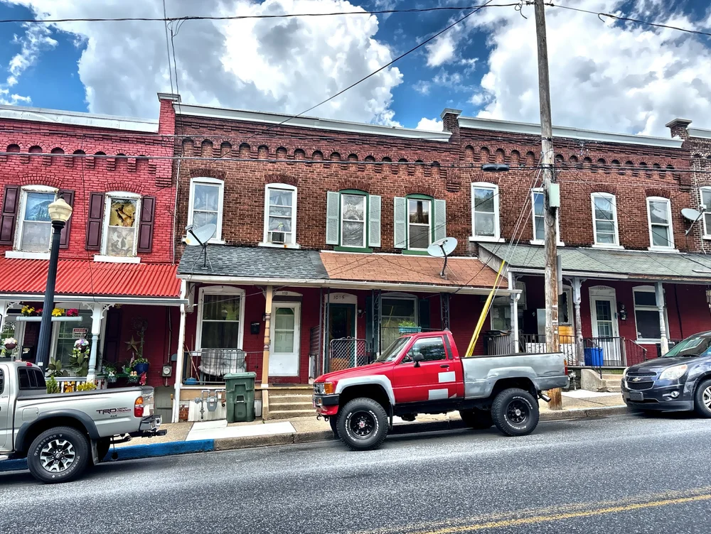  Some of the houses that were originally occupied by Bethlehem Steel workers still stand today on a hill overlooking the former workplace. 