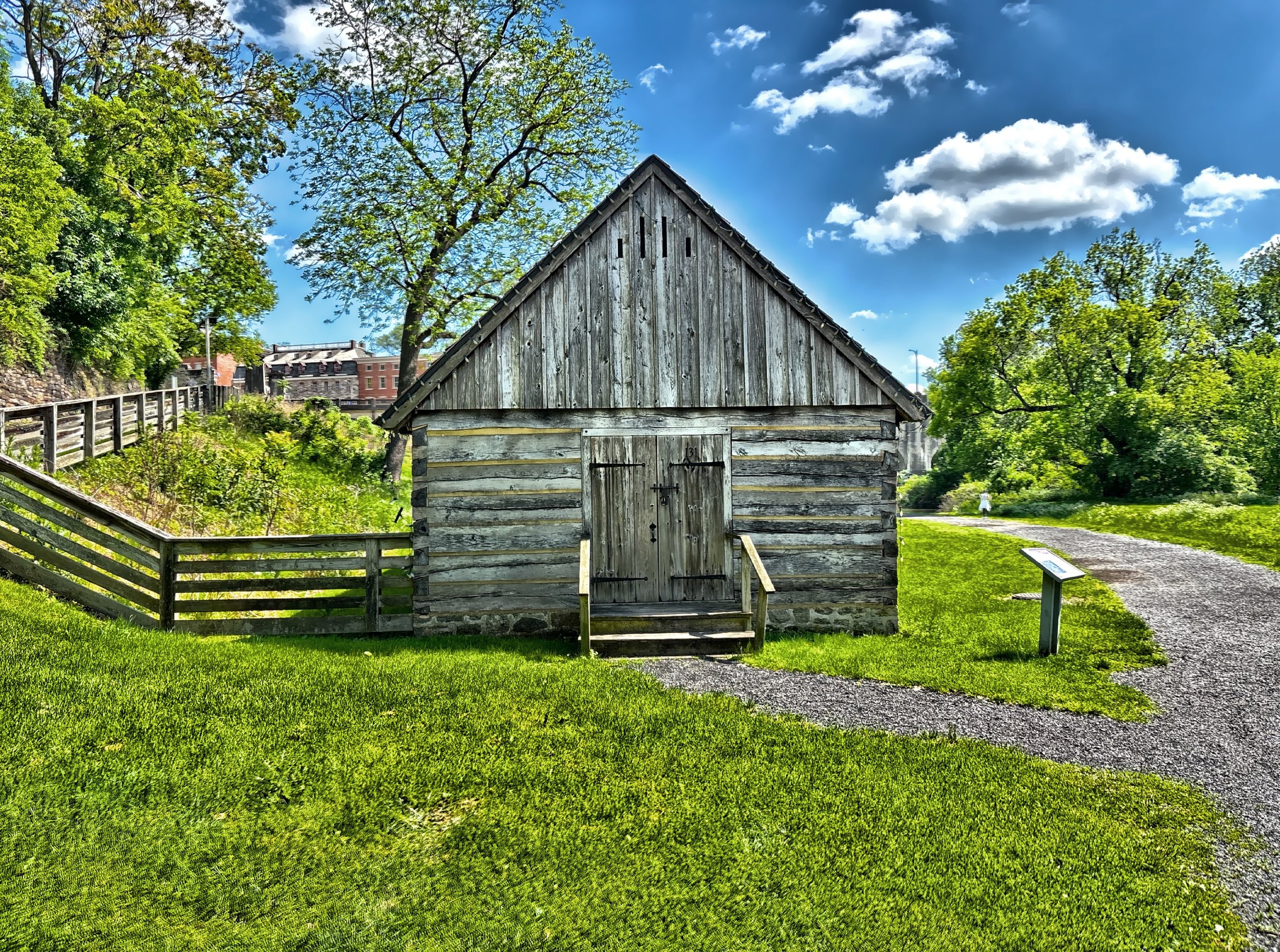 The Springhouse c. 1970 is a reconstructed log building of white oak timber on the site of the original springhouse and milk house which was constructed in 1764. 