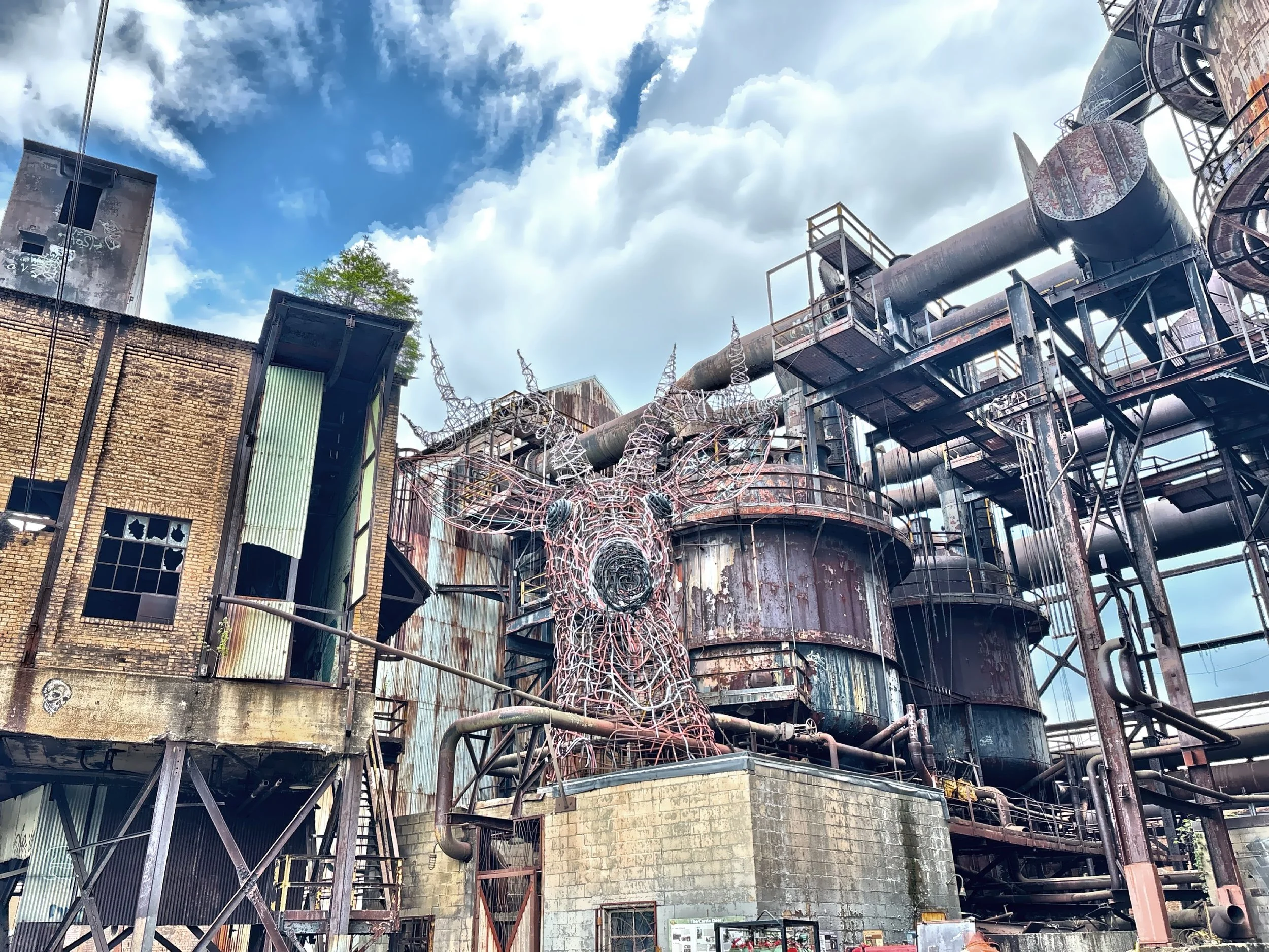  The massive industrial art deer sculpture was crafted by material found on site by the Industrial Arts Coop in 1997-1998. 