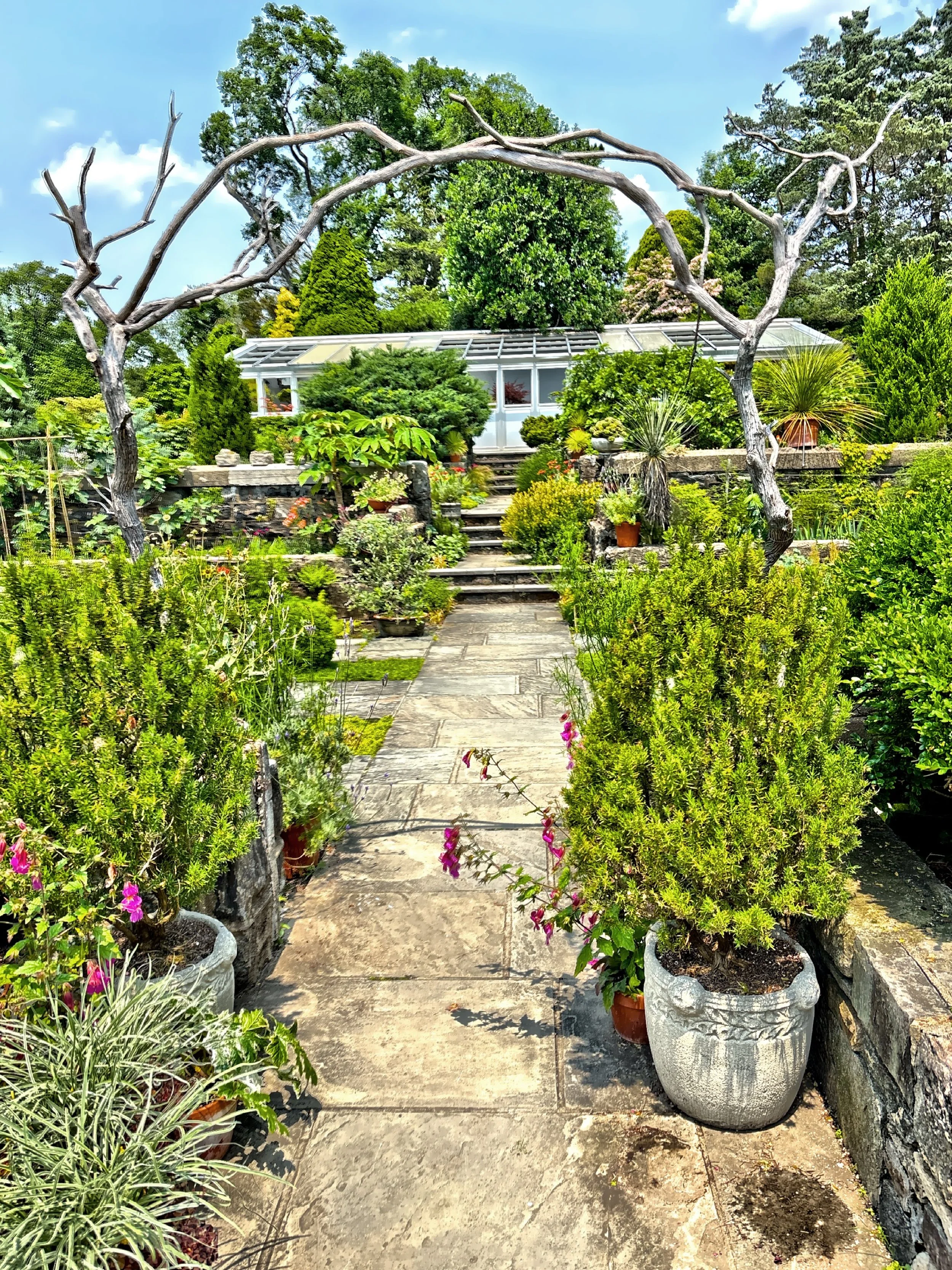  Themed gardens include Perennial flower garden, Shade Border, Elliptical Garden, and Conifer Slope. 