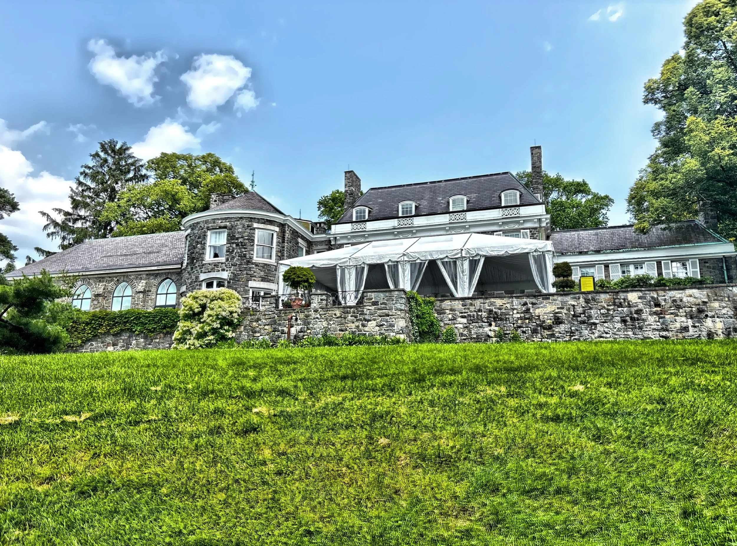  The rear facade of Wave Hill House. 