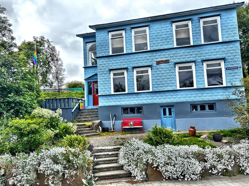  Colorful buildings, cafés, and local shops line the streets. 
