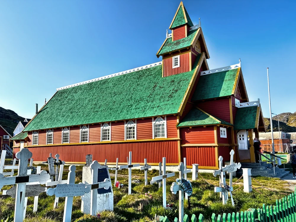  Proudly standing above the harbor like a guardian is the Salvation Church, a beautiful Norwegian-style stave church built in 1849.  Step inside, and you’ll feel the quiet reverence of a time when craftsmanship and faith were intertwined.  The church
