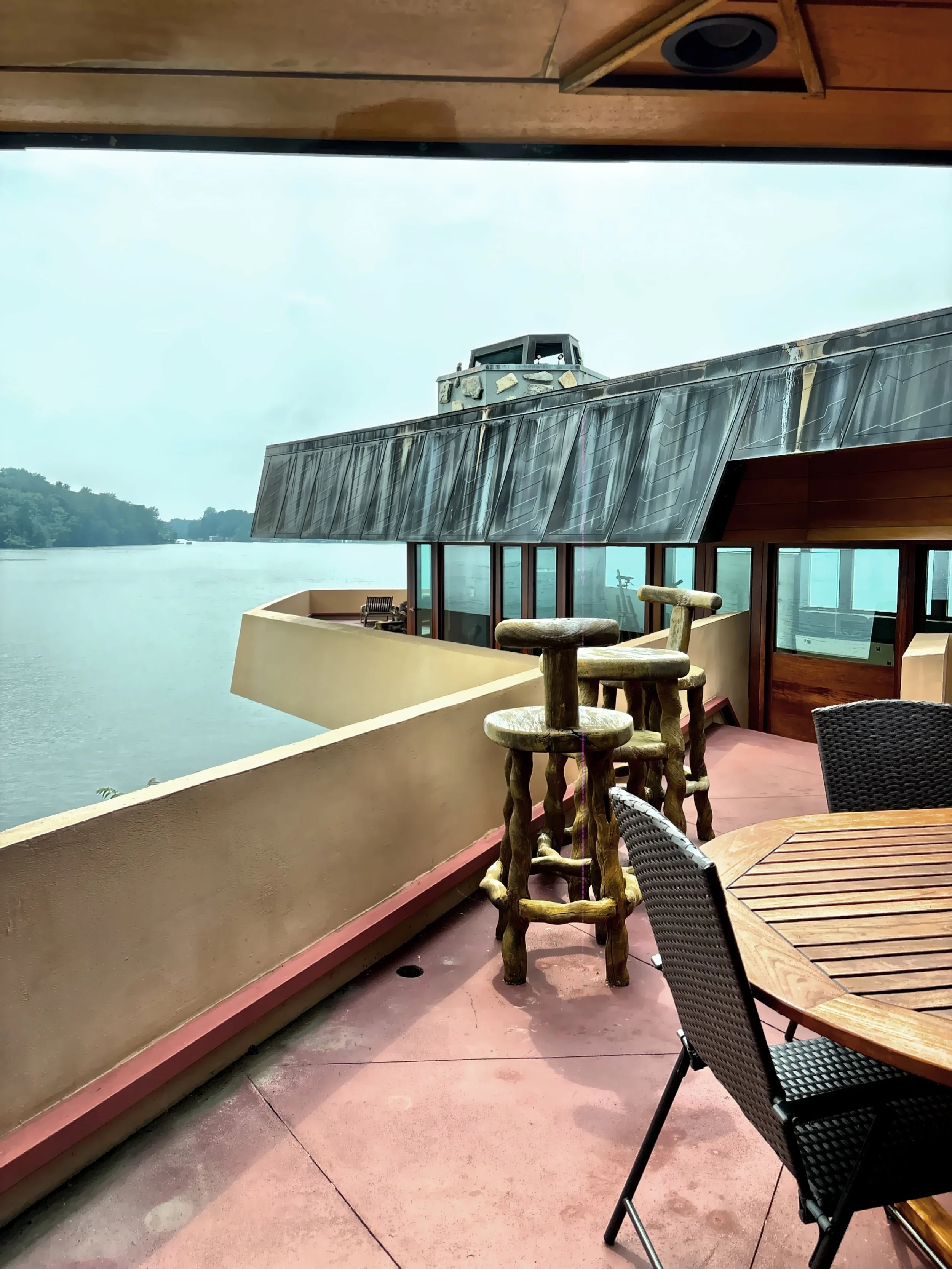  Looking out to the section of terrace that wraps around three sides of house, mostly over the lake. 