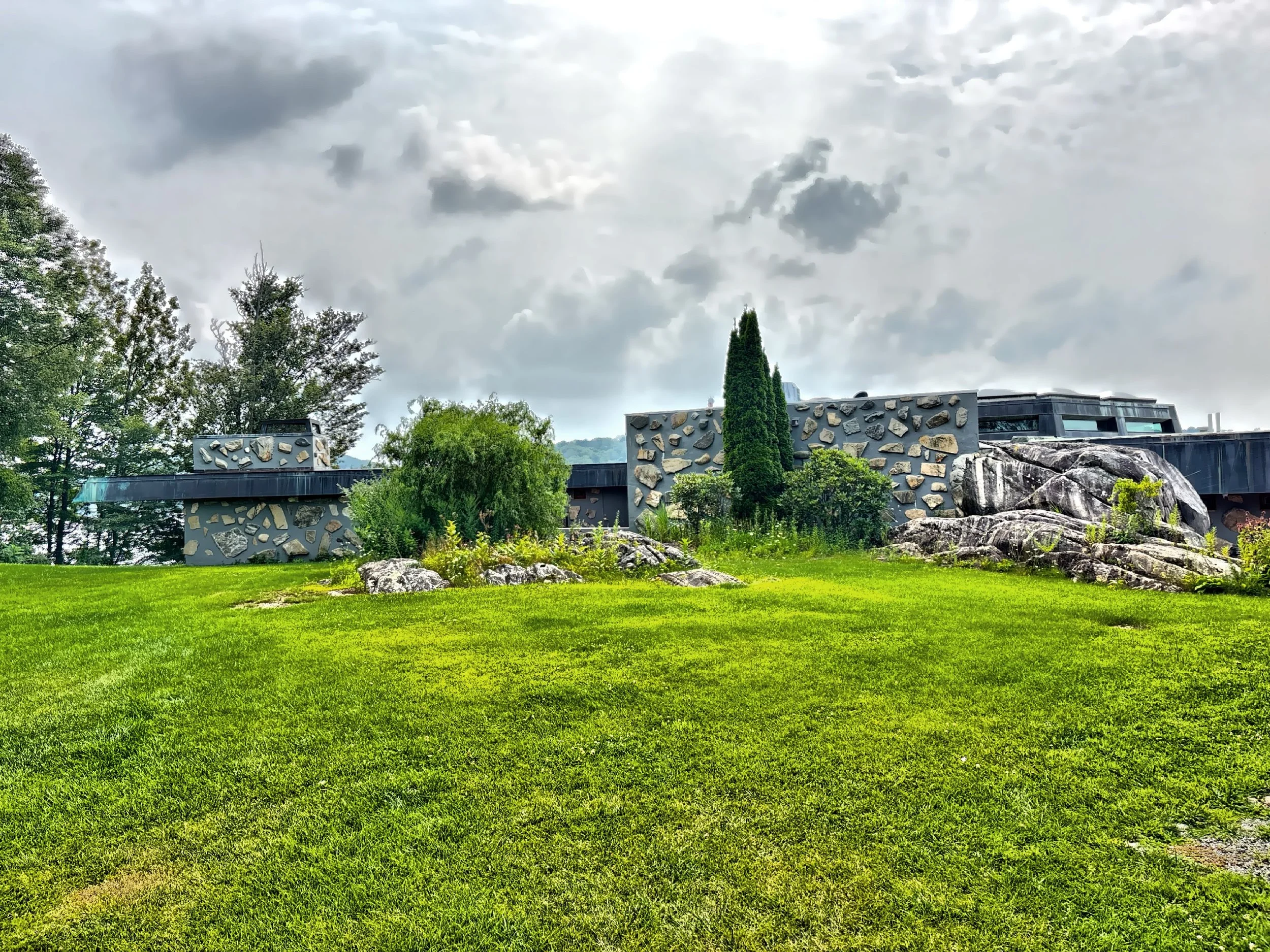  The rear facade of the house blending into the landscape.  This facade conceals the main entrance to the house. 