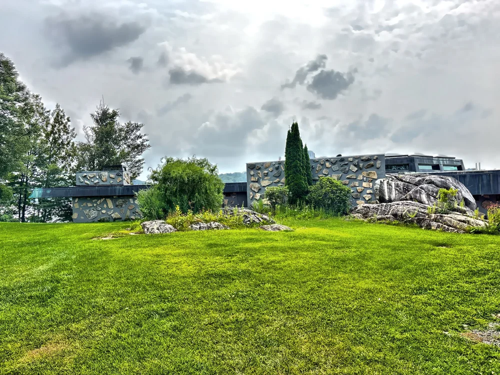  The rear facade of the house blending into the landscape.  This facade conceals the main entrance to the house. 