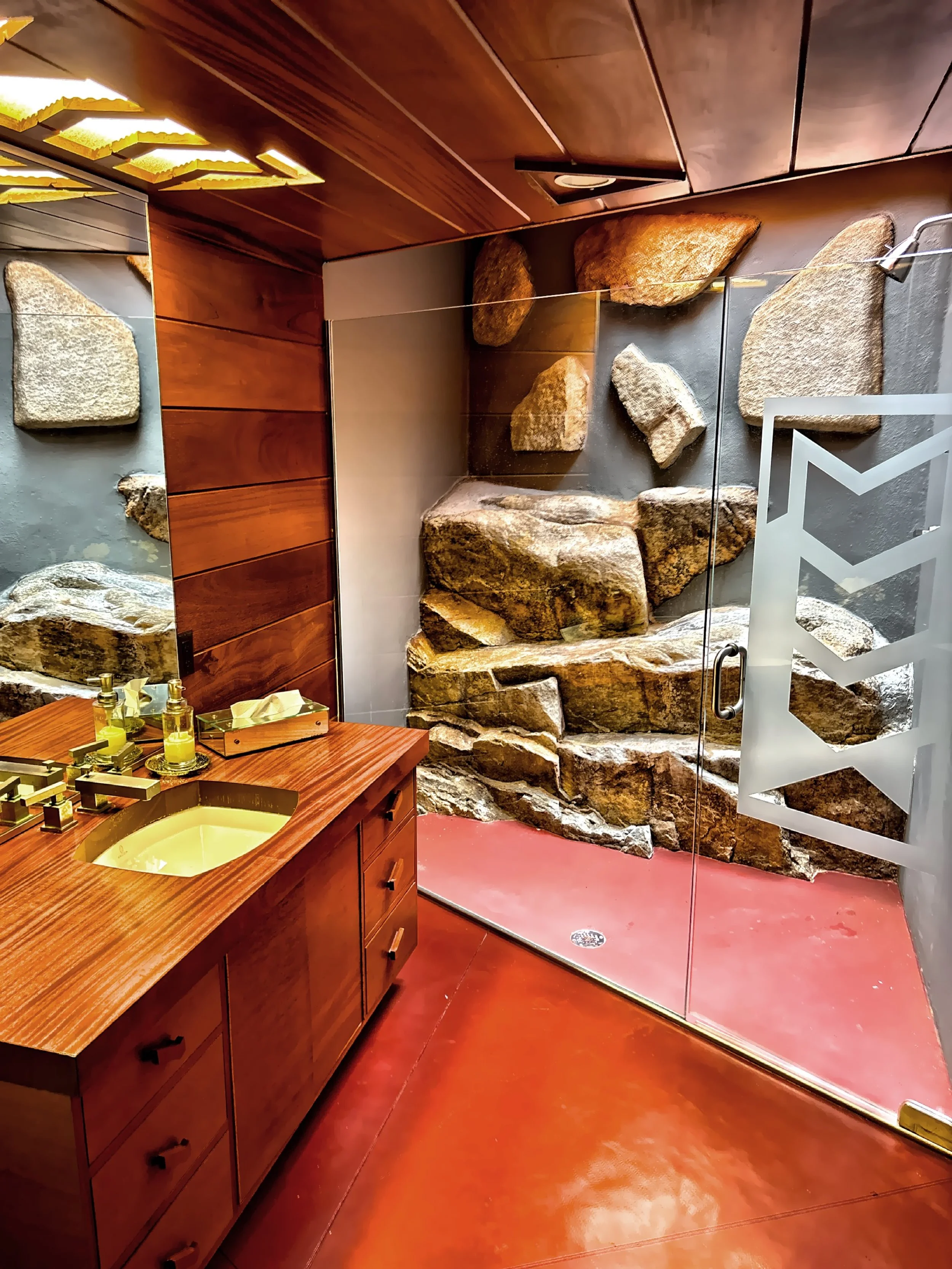  Sone and wood are used in this bathroom. 