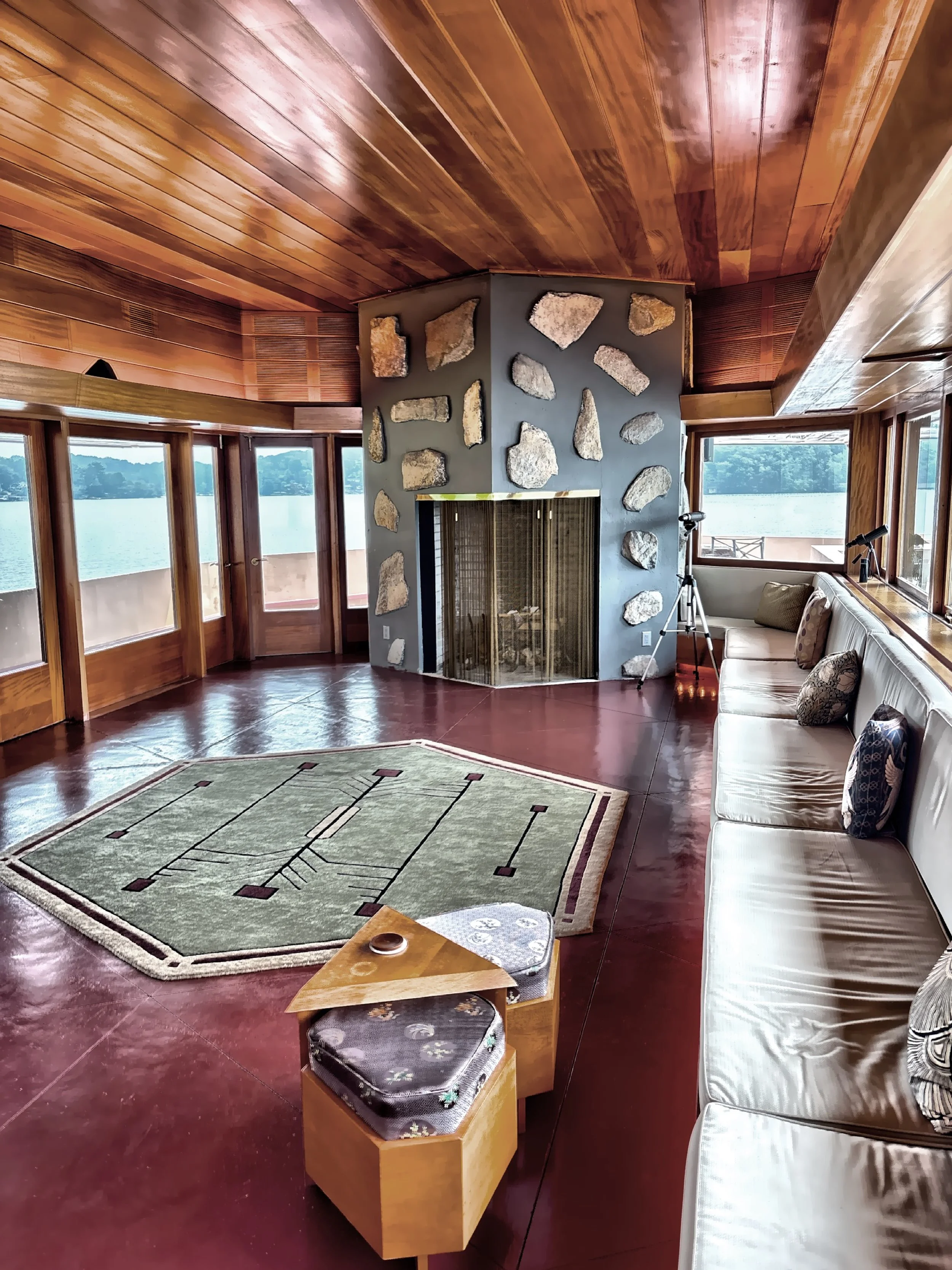  The long, windowed living area with fireplace.  