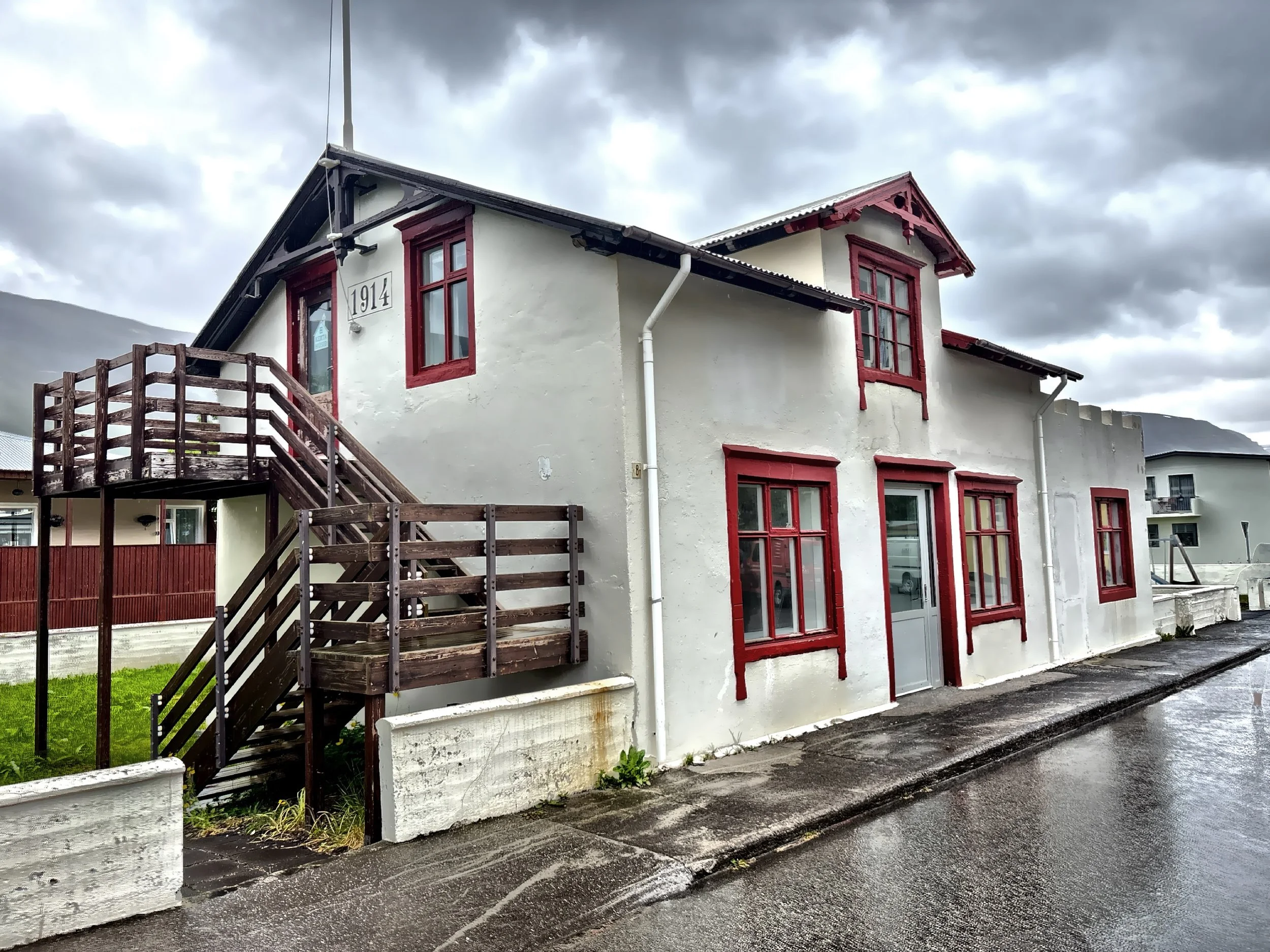  19th-century wooden houses line the narrow streets, giving it a quaint, timeless feel. 