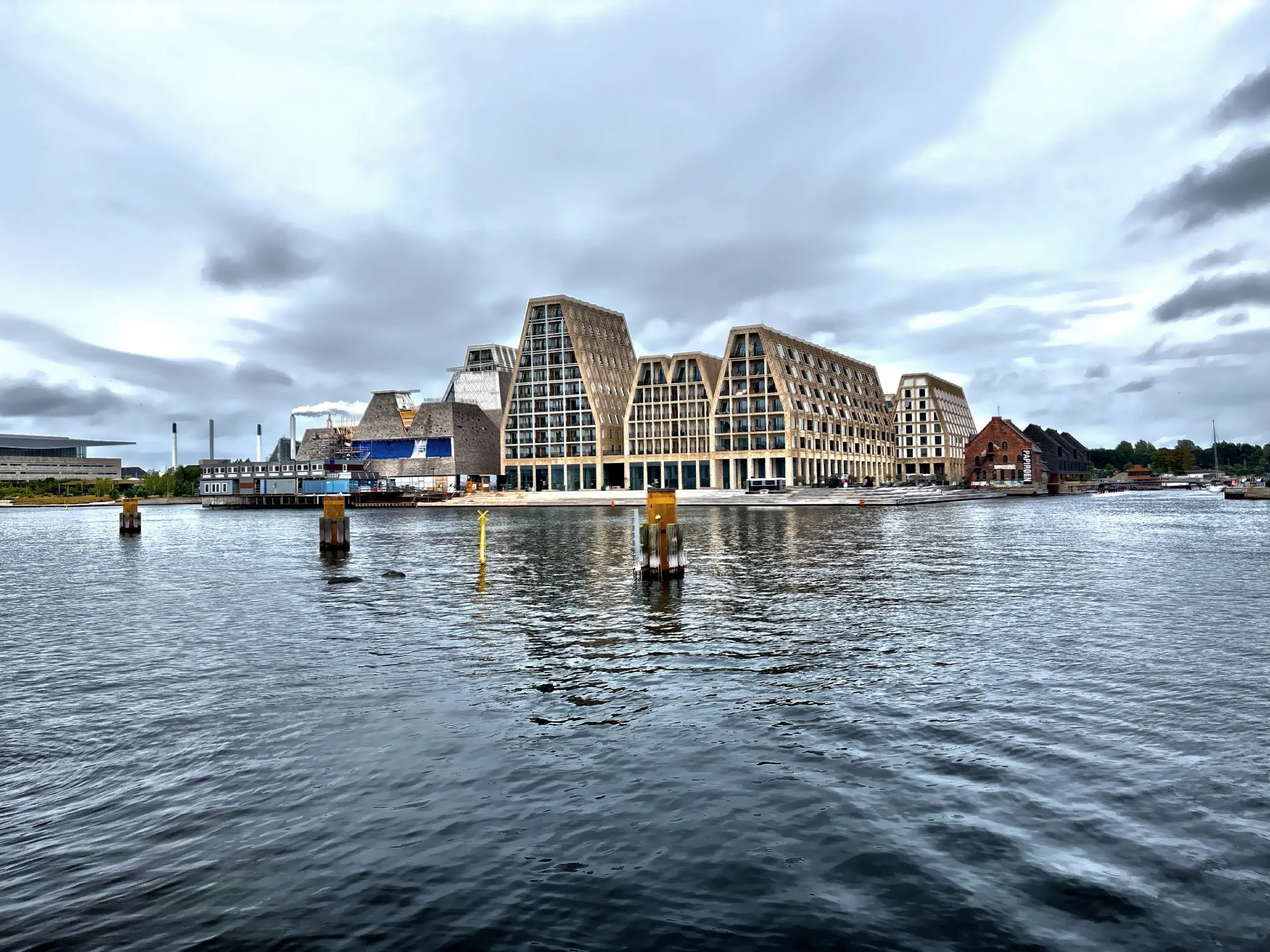  Paper Island, once home to Copenhagen’s paper storage warehouses, has transformed into a bold symbol of urban renewal and creative reuse.  The island’s striking waterfront architecture and sustainable design initiatives, continue to reflect Copenhag