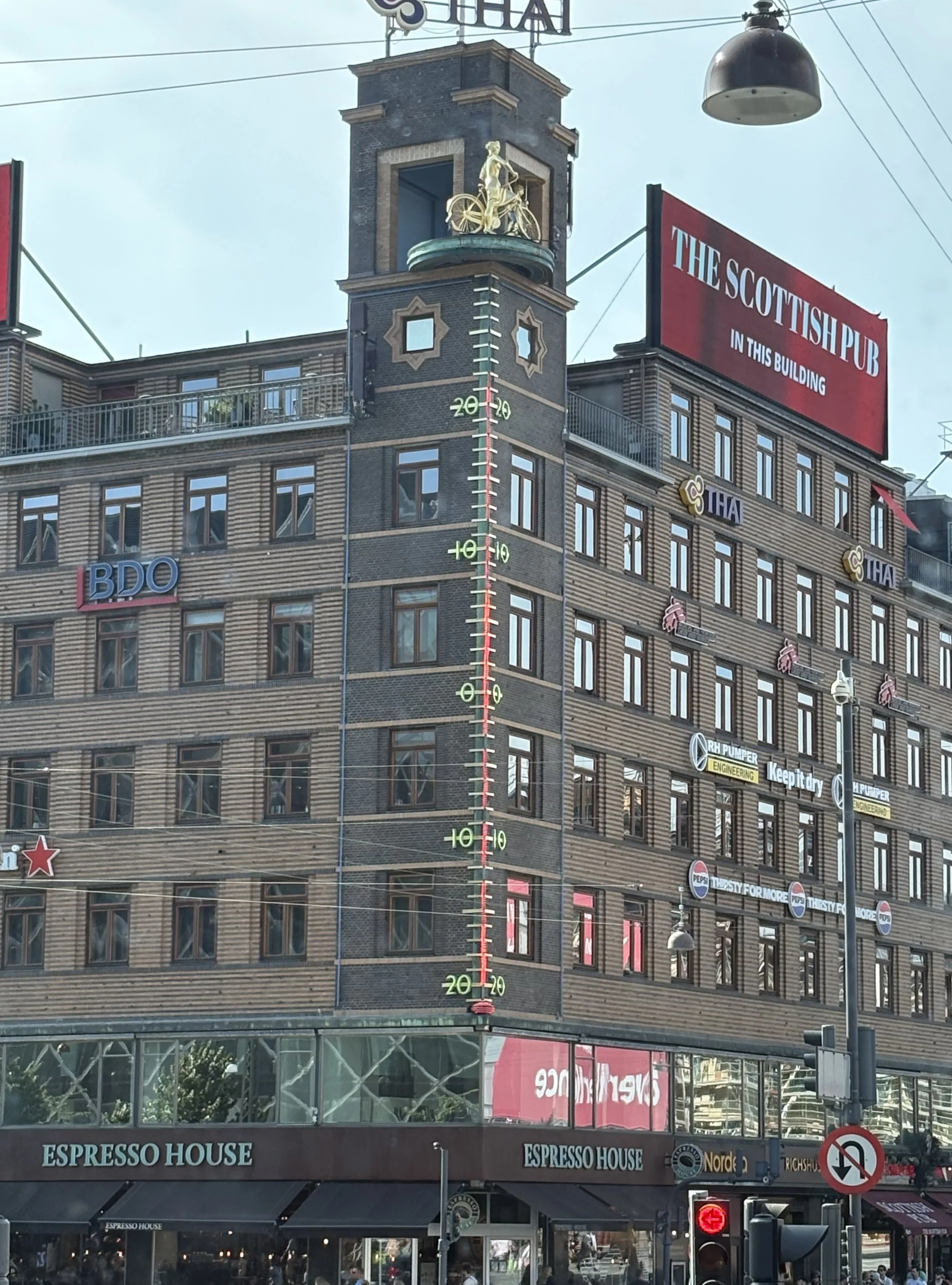  The ‘Weather Girls’ sculpture atop the Richshuset Building features two gilded female figures on a rotating disk that serves as a whimsical weather forecast.  When the weather is fair, a girl on a bicycle appears; when rain is expected, a girl holdi