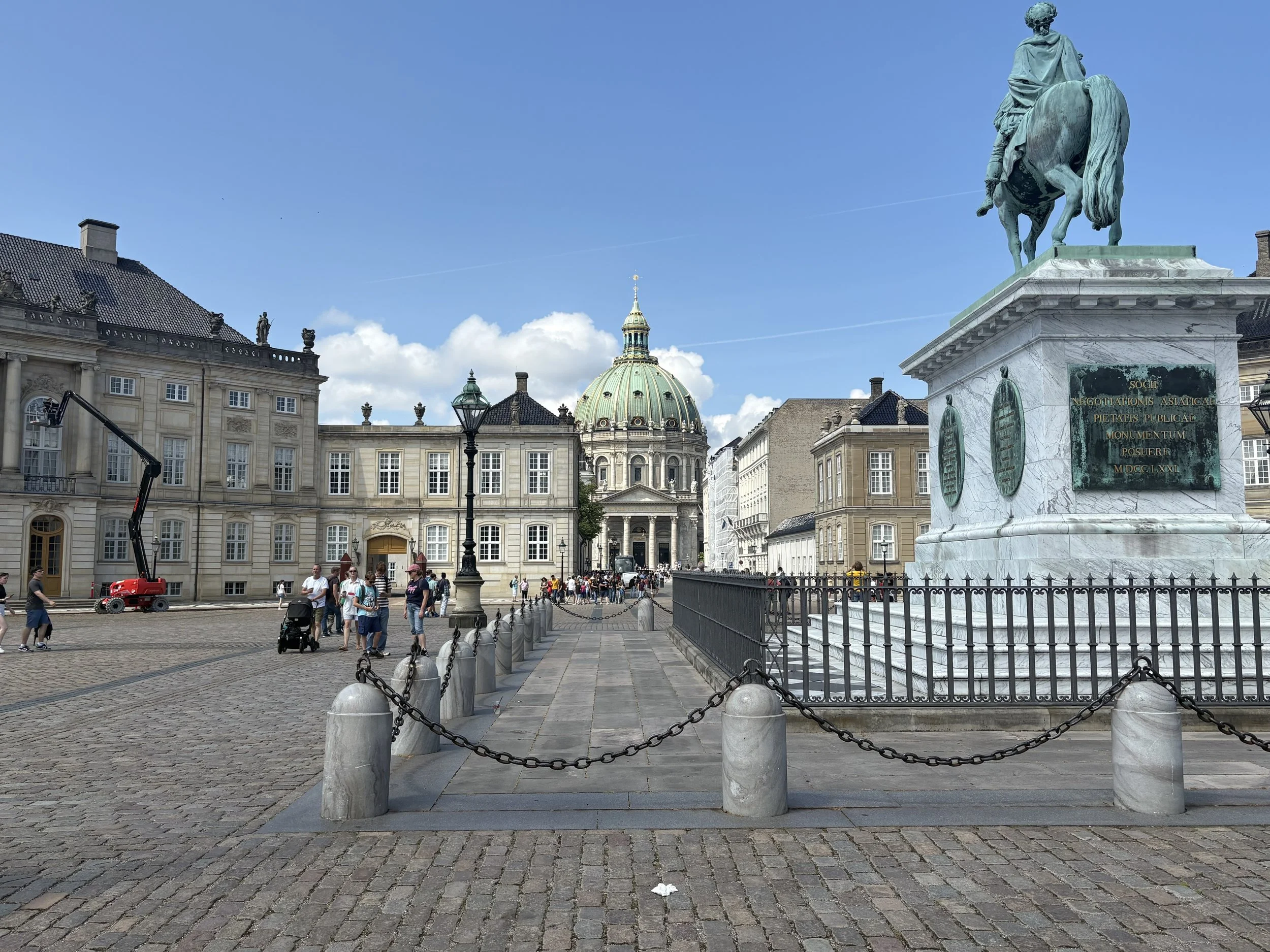  Amalienborg is the official residence of the Danish Royal Family, it consists of four identical palaces surrounding Amalienborg Square.  In the background is the domed Frederik’s Church (aka Marble Church).  In the center of of the square stands the