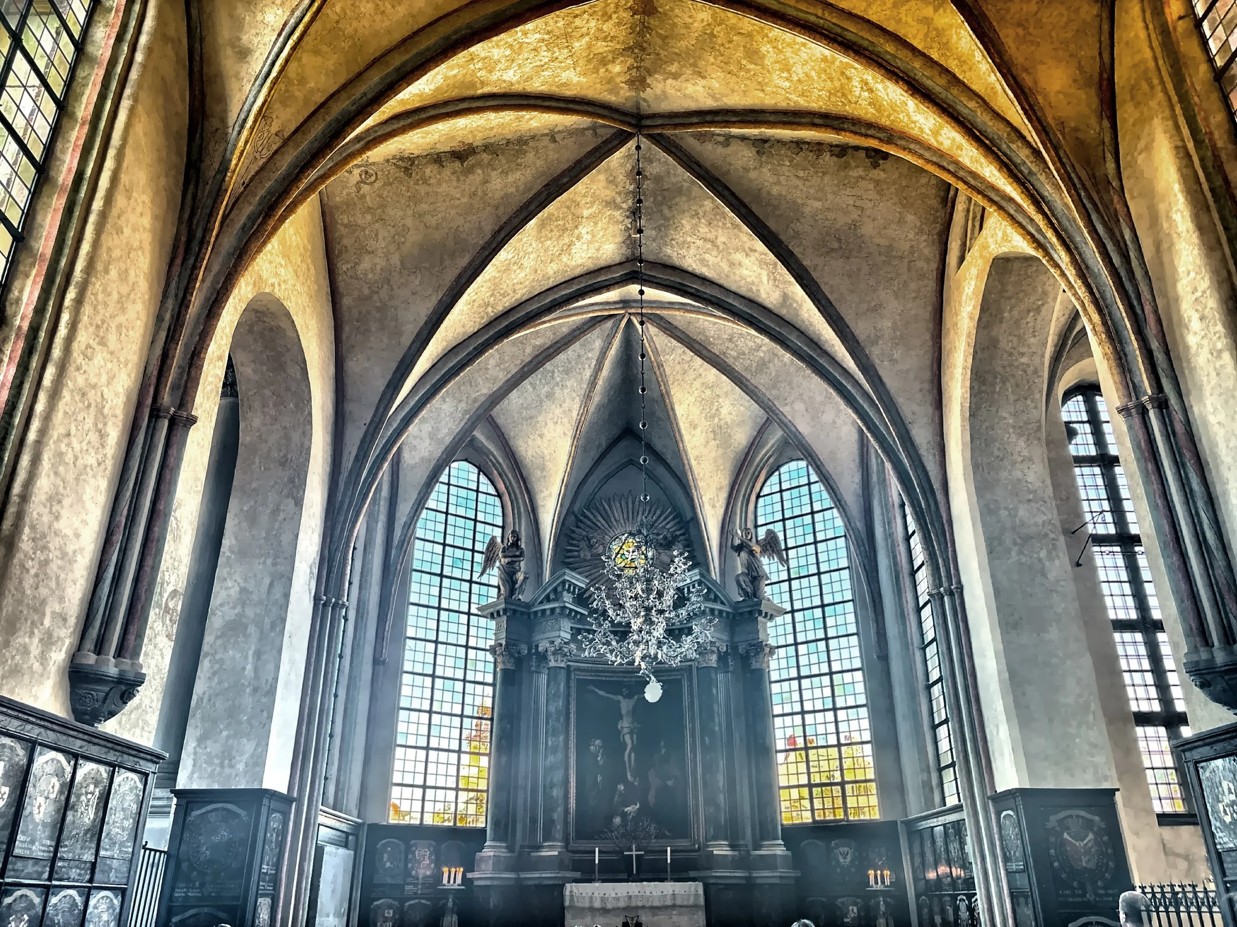  The Gothic architecture, with its high vaulted ceilings and tall windows, creates an atmosphere of solemn majesty. 