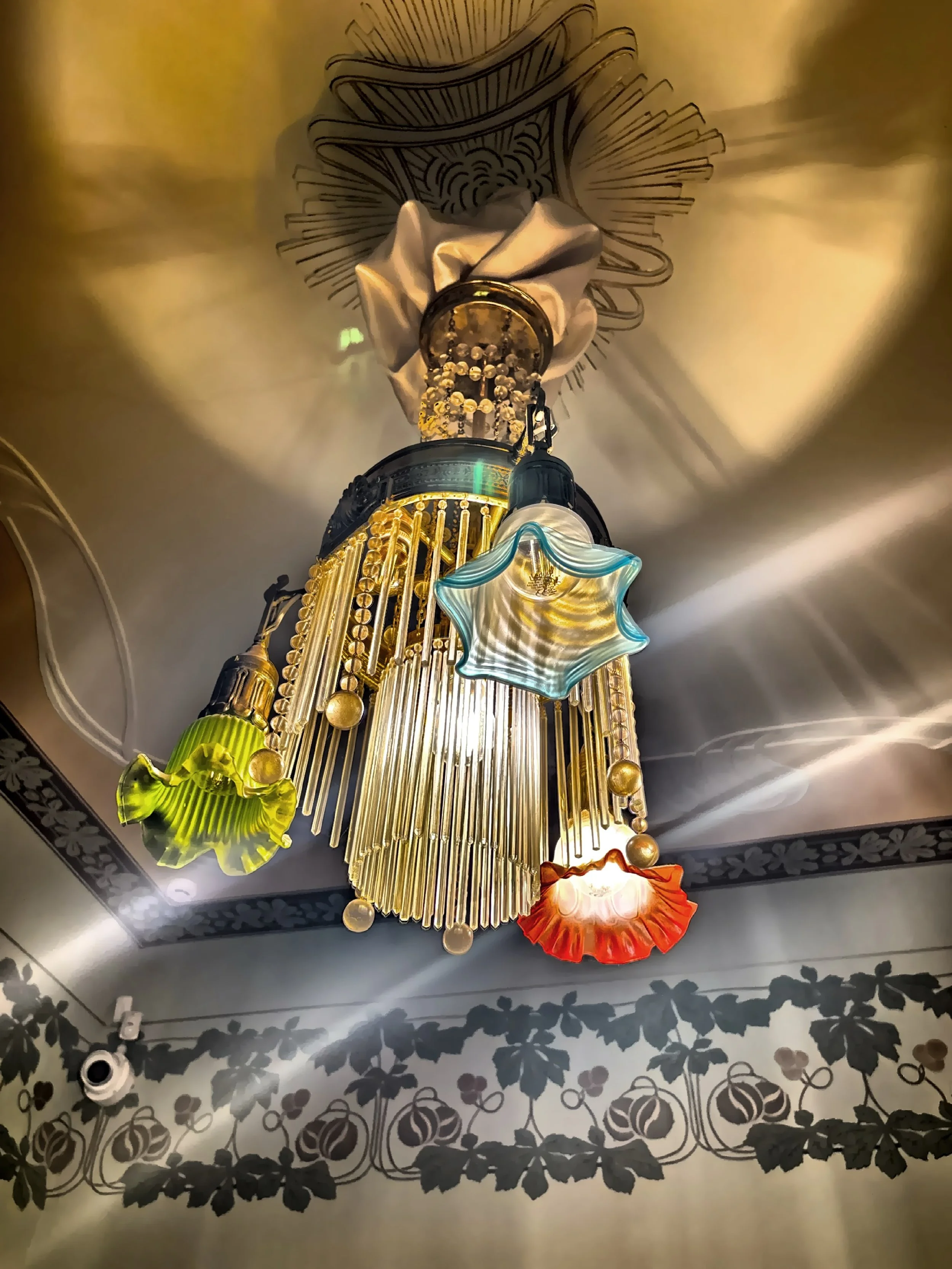  An elaborately decorative ceiling light fixture. 