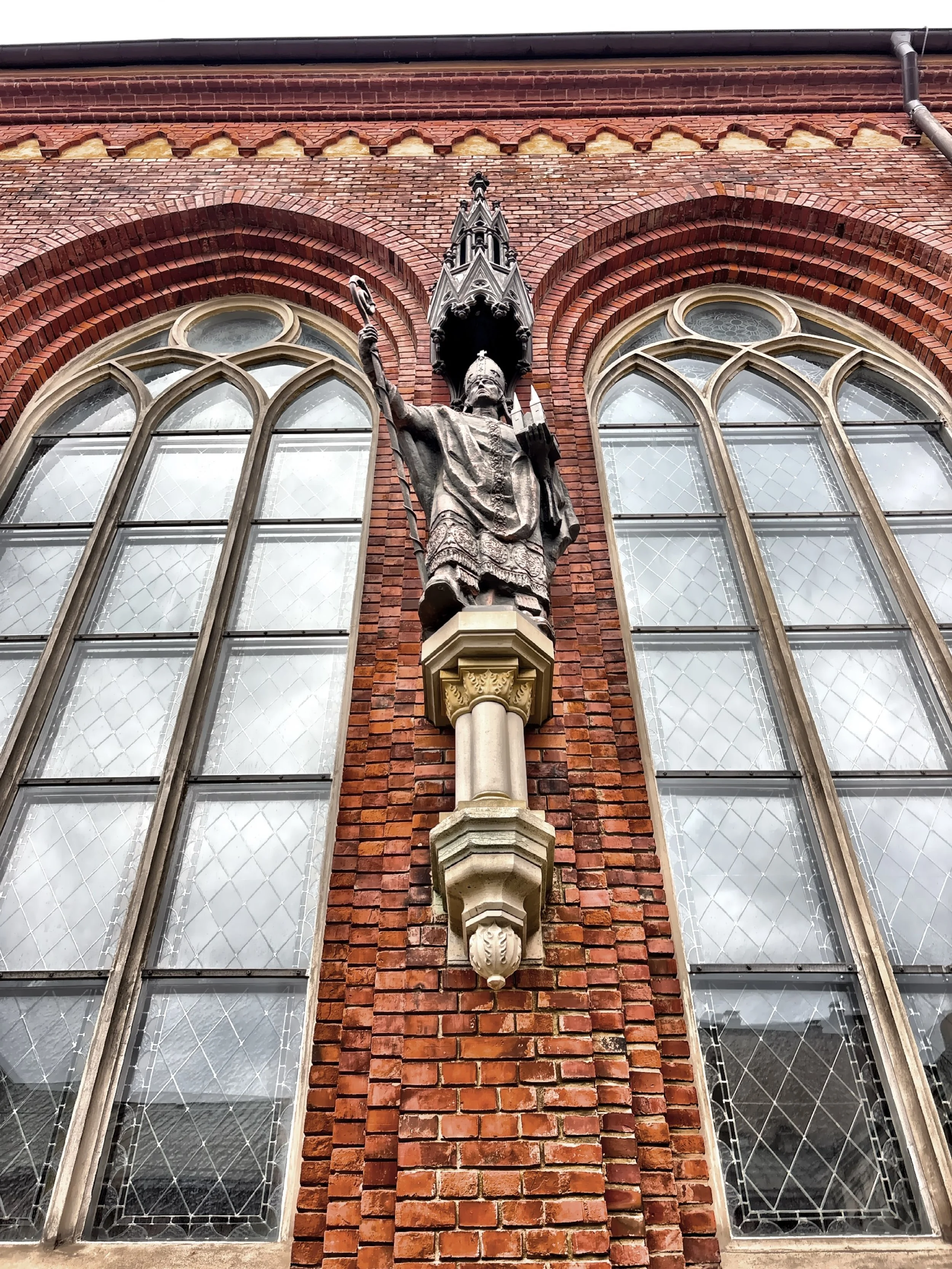  The statue of Bishop Albert of Riga located on the cloister wall. 