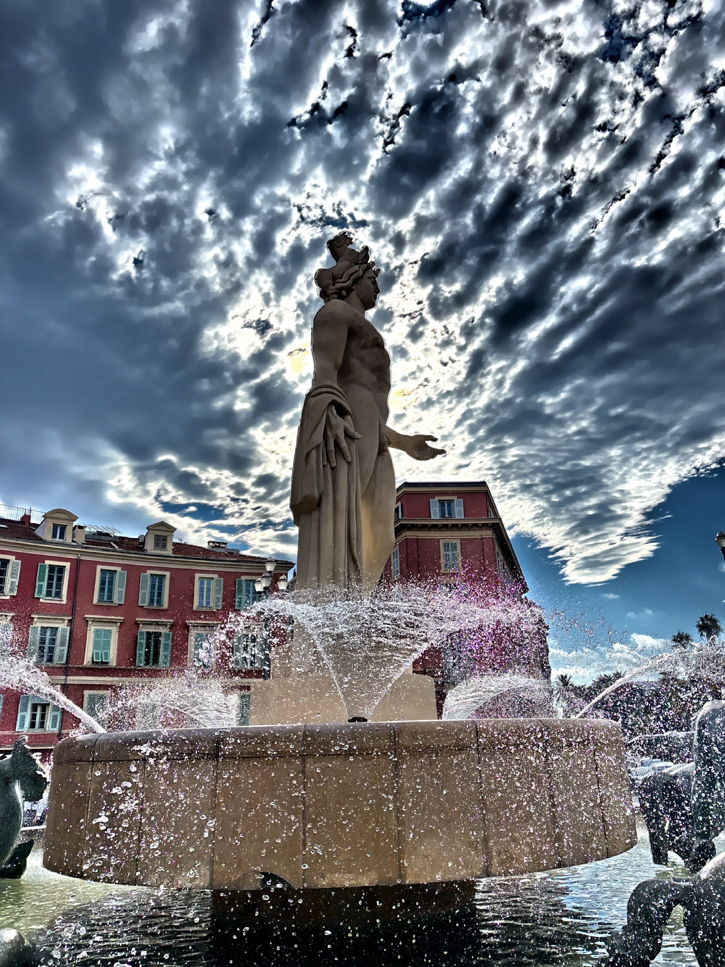  The 23-foot tall marble Fontaine du Soleil in Place Massena.  