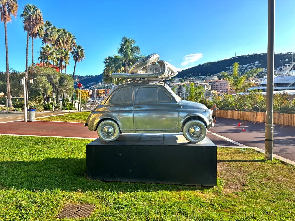  The sculpture titled ‘A Sunday In Nice’ is a cast aluminum replica of a classic Fiat 500 with surfboard created by French artist Stephane Cipher. 
