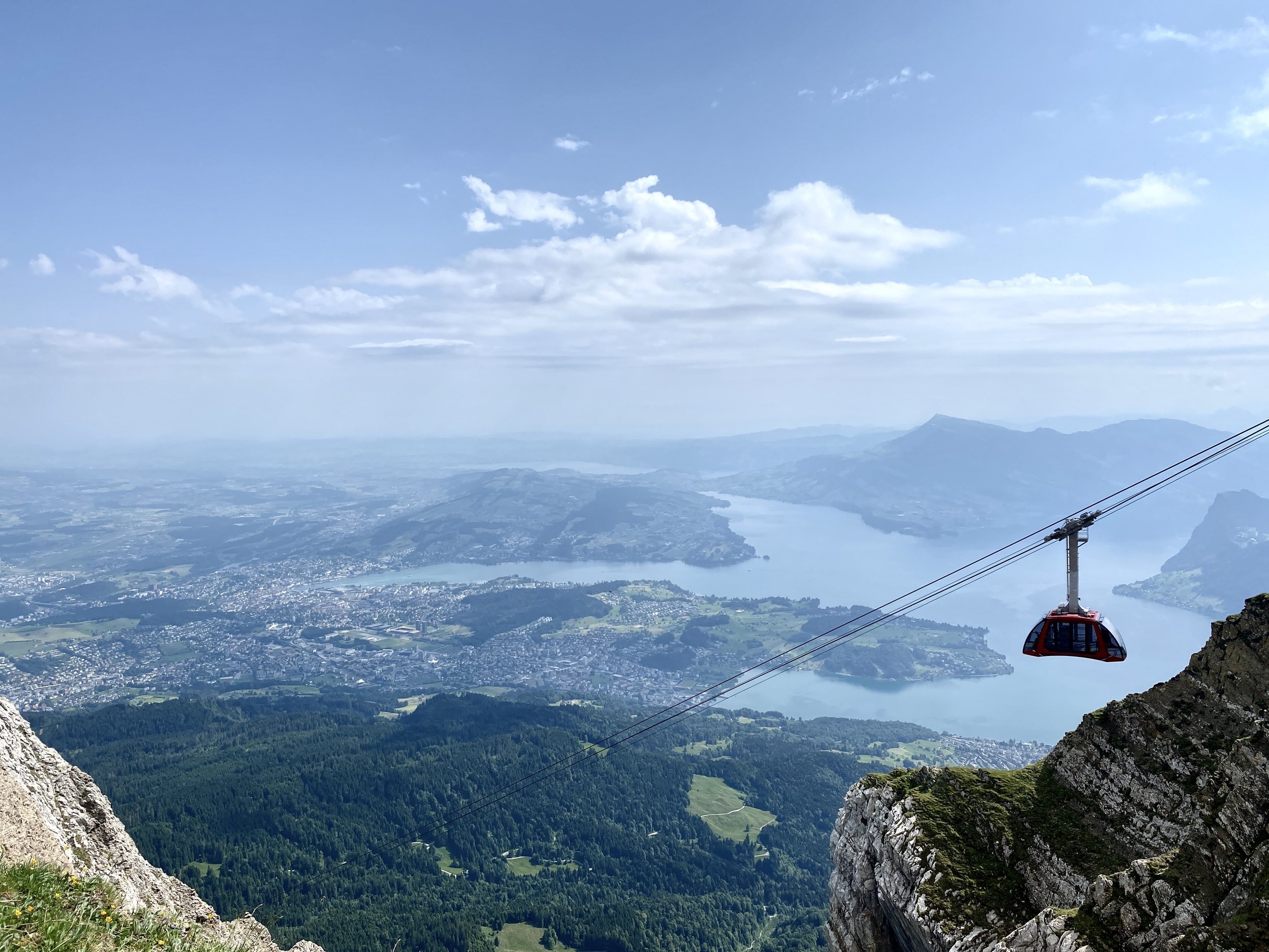  From here, the Dragon Ride we took back down looks like it's dangling by a thread — impossibly small against the vast mountainside. 