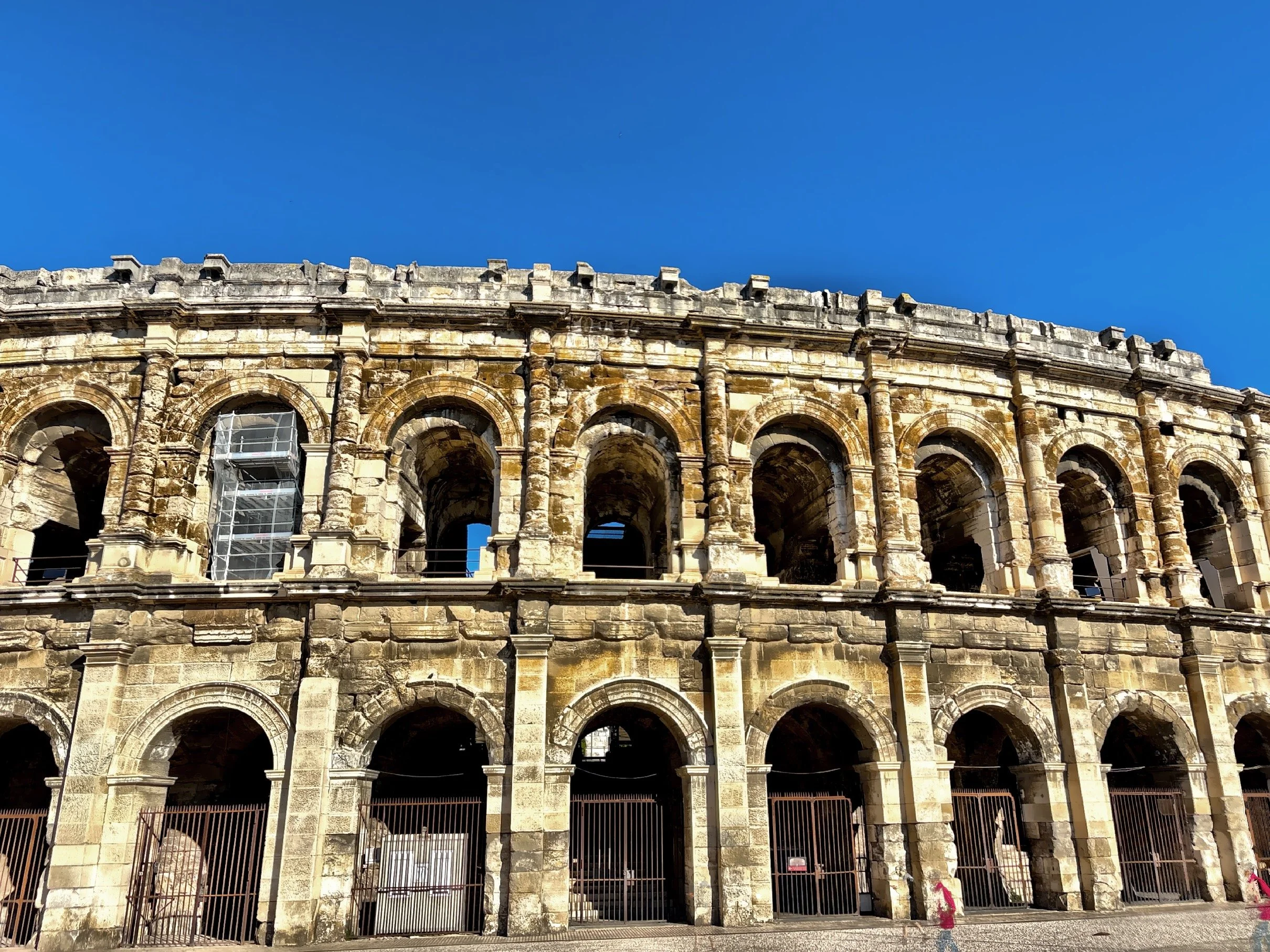  As the Roman Empire declined, gladiatorial games ceased and the amphitheater lost its original function.  It was used as a fortress and became a shelter for local residents during times of instability, and by the 12th century it was essentially a mi