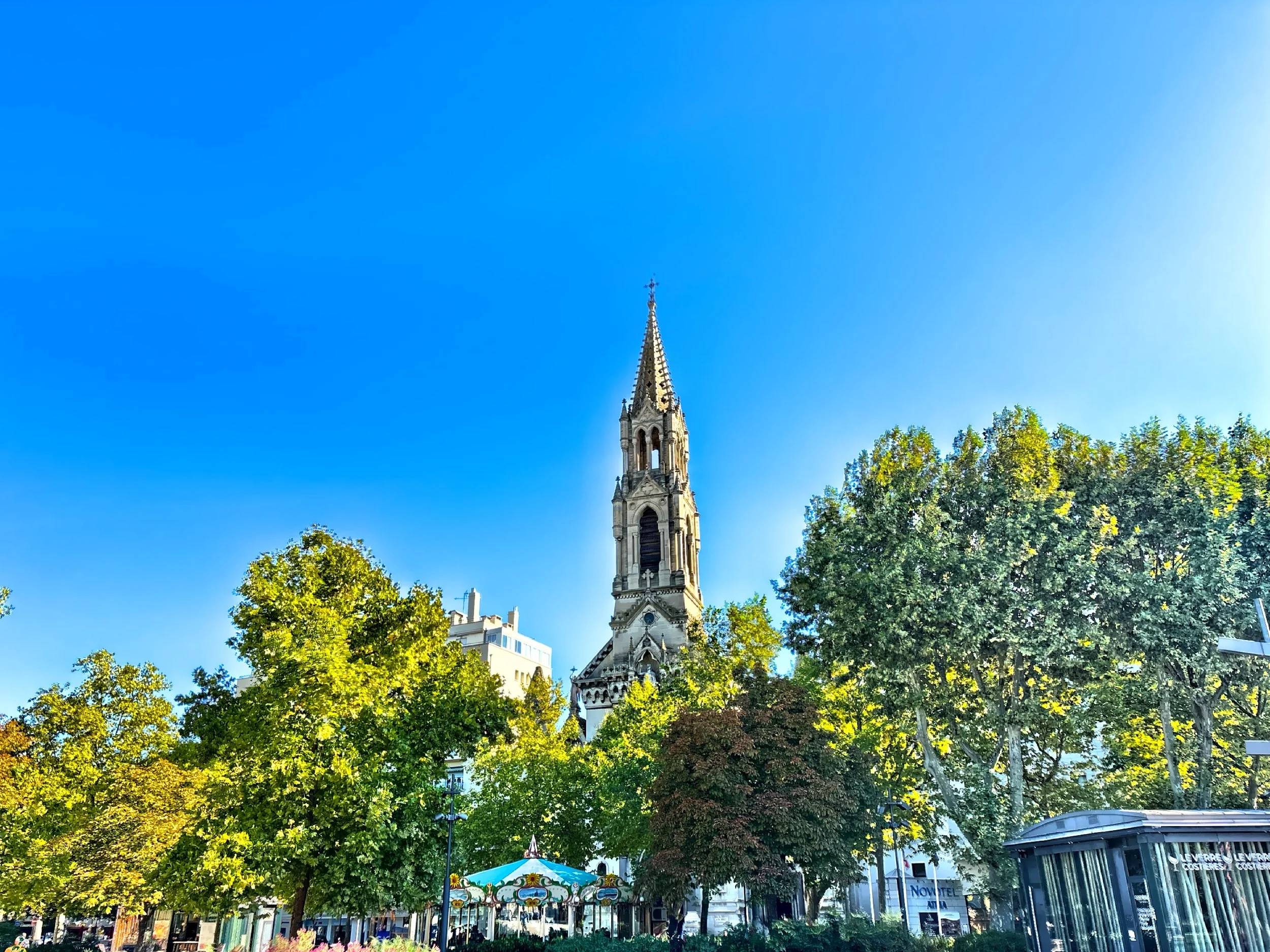  The steeple of the Church of Saints Perpetua and Felicity stands high above the trees. 