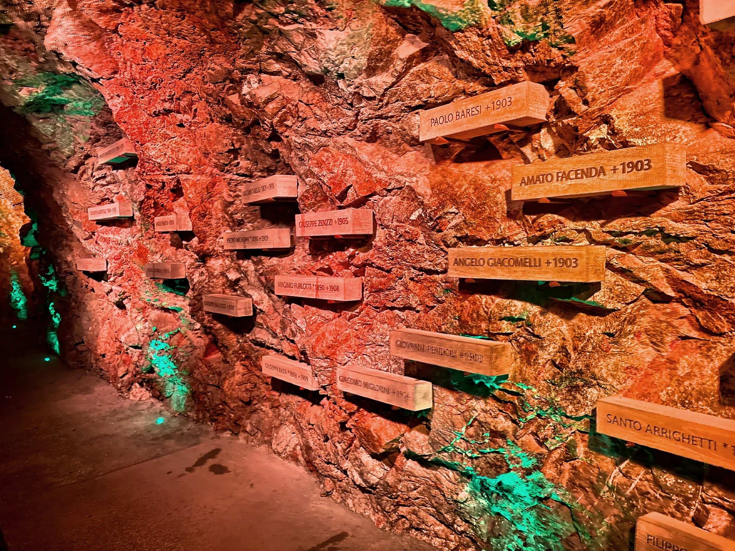  This exhibit shows commemorative plaques of climbers and the year completed. 
