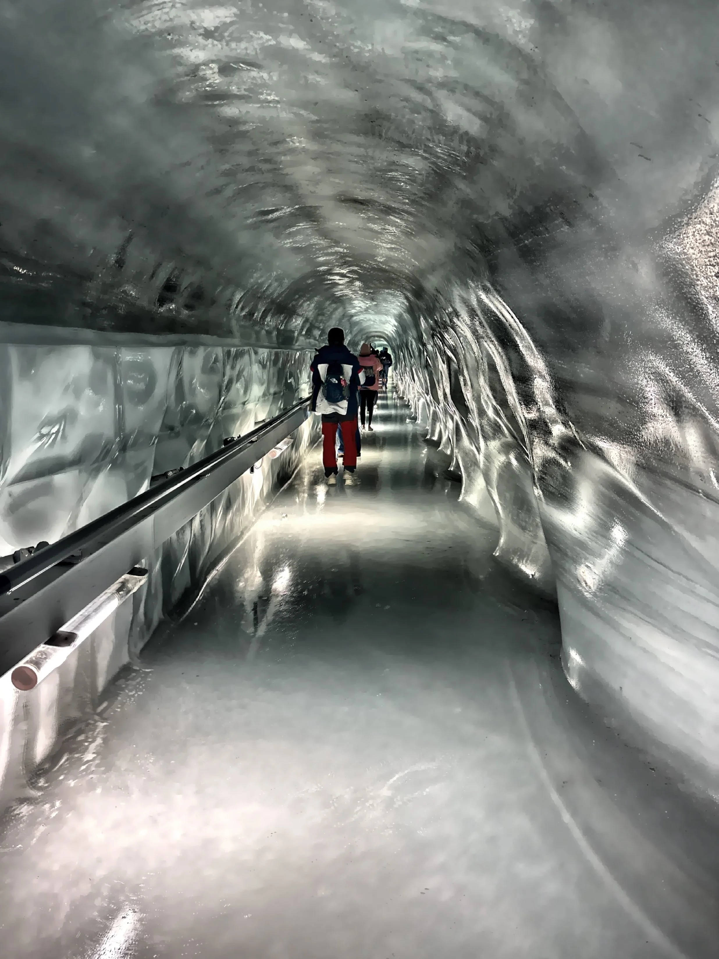  This is Ice Palace with crystal-blue walls, slippery floors, and beautifully carved ice sculptures of animals, people, and symbols of Switzerland. 