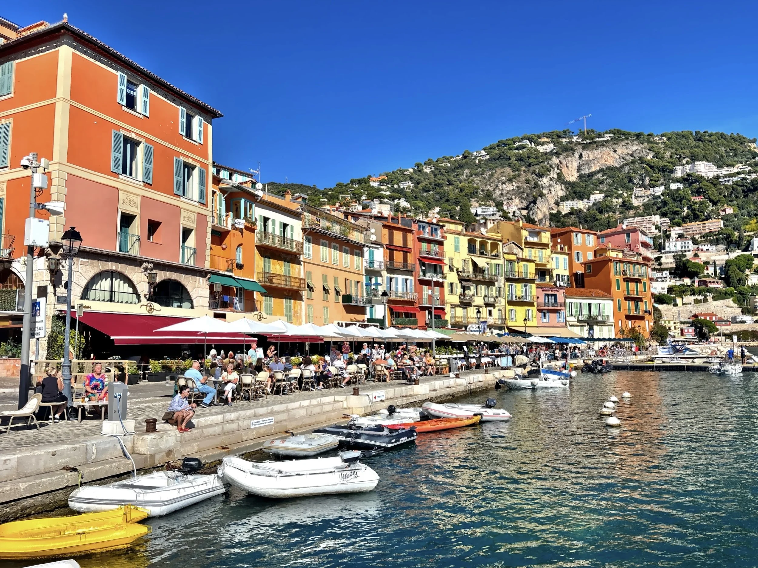  The Mediterranean sparkles as boats sway lazily in the water, and the village stretched along the curve of the bay like a painting come to life. 