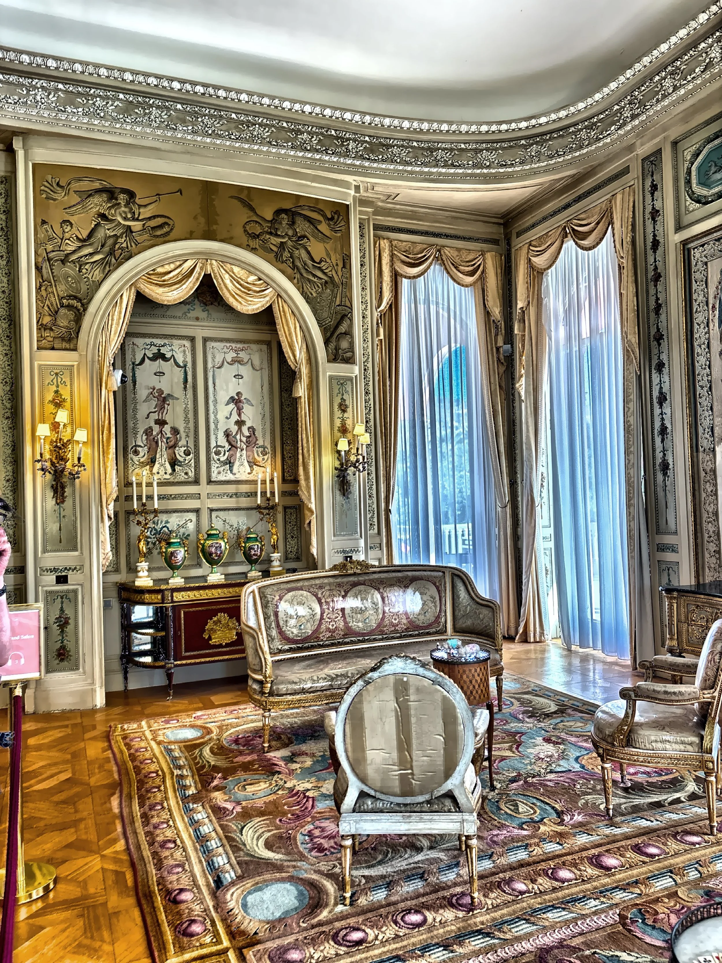  The Grand Salon, is a formal reception room featuring Louis XVI-style furnishings and large windows that frame the gardens and Mediterranean beyond. 