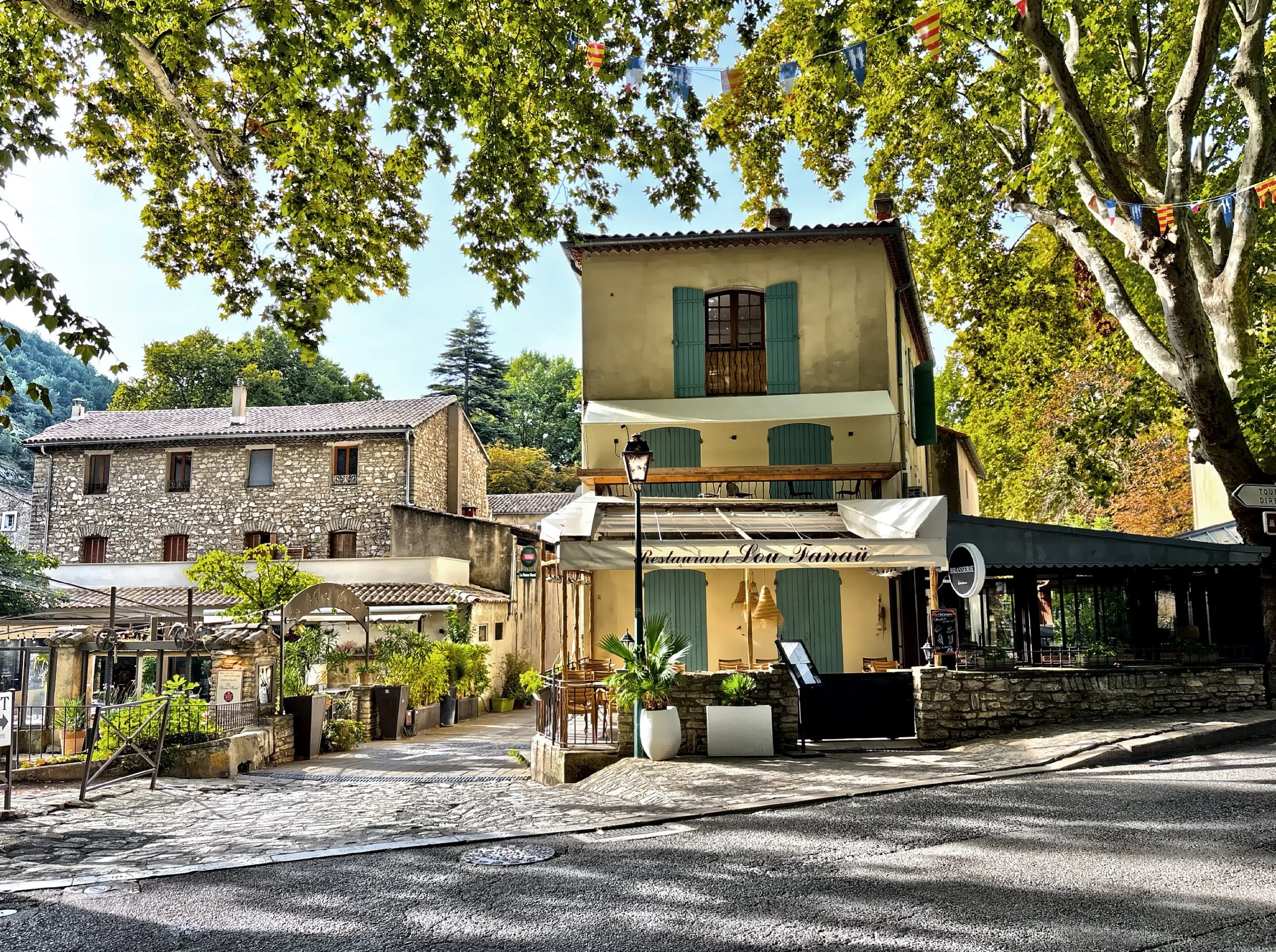  The small village is picturesque, with cobbled streets, riverside cafes, and stone houses framed by lush greenery. 